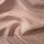 Soft dusty rose linen viscose plain fabric shown styled for abaya and modestwear designs.
