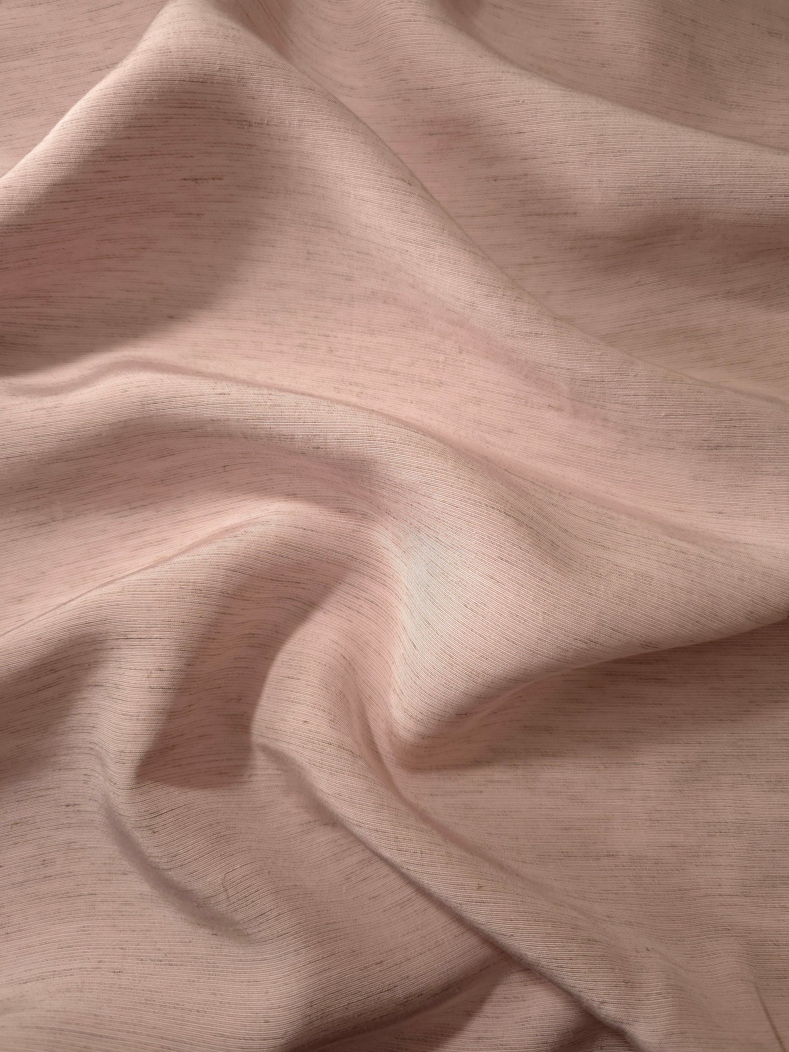 Soft dusty rose linen viscose plain fabric shown styled for abaya and modestwear designs.