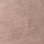 Draped view of soft dusty rose linen viscose plain fabric, showing the fluid drape used for dresses and skirts.