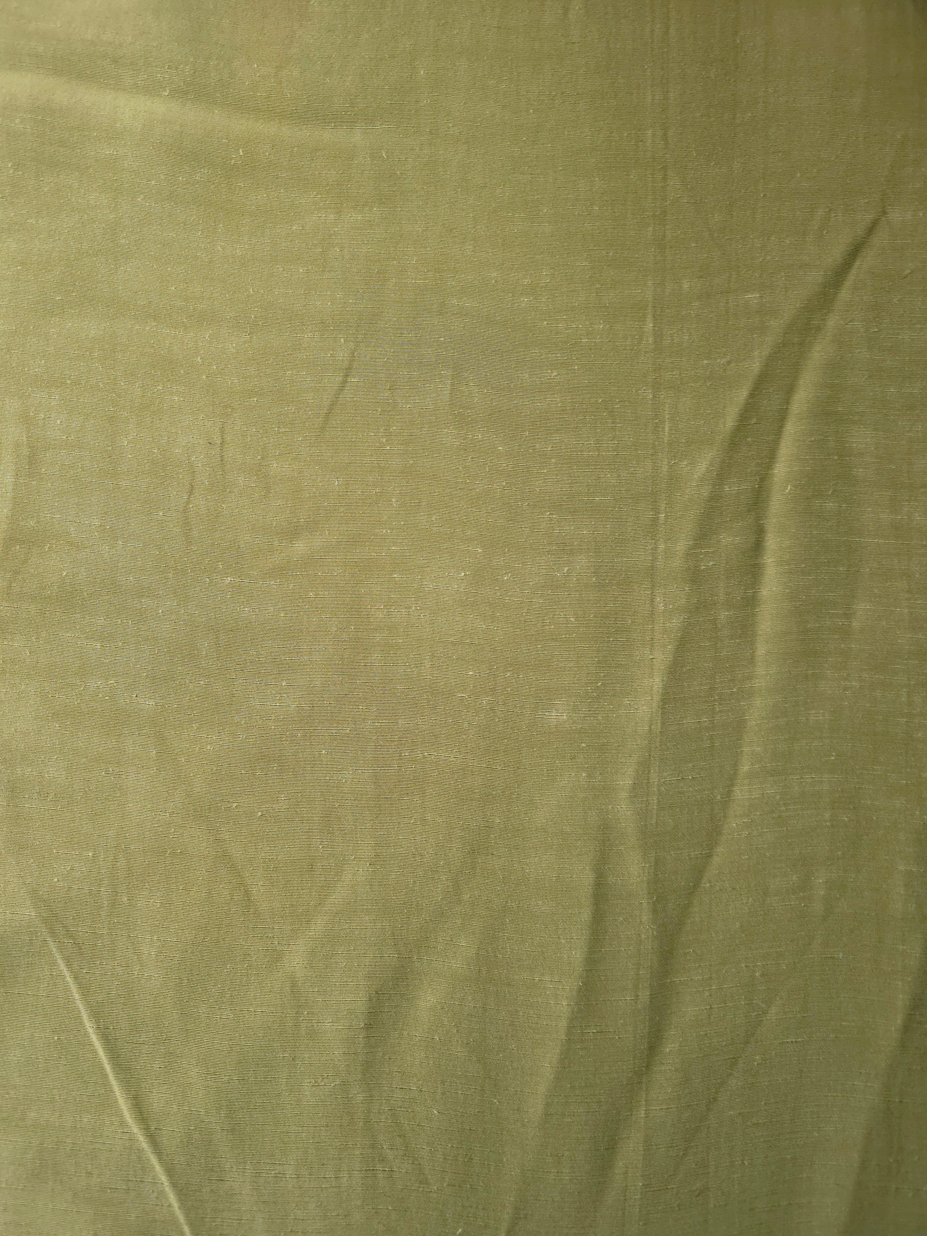Fresh apple green linen viscose plain fabric with a smooth, breathable weave suited for warm-weather apparel.