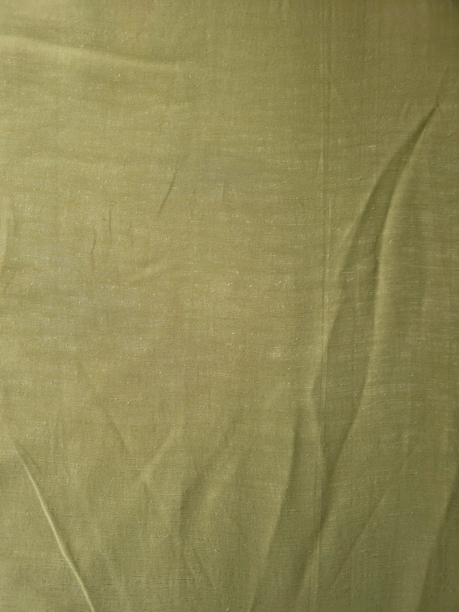 Fresh apple green linen viscose plain fabric with a smooth, breathable weave suited for warm-weather apparel.