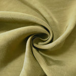 Fresh apple green linen viscose plain fabric styled for modestwear, with a matte, soft-touch finish.
