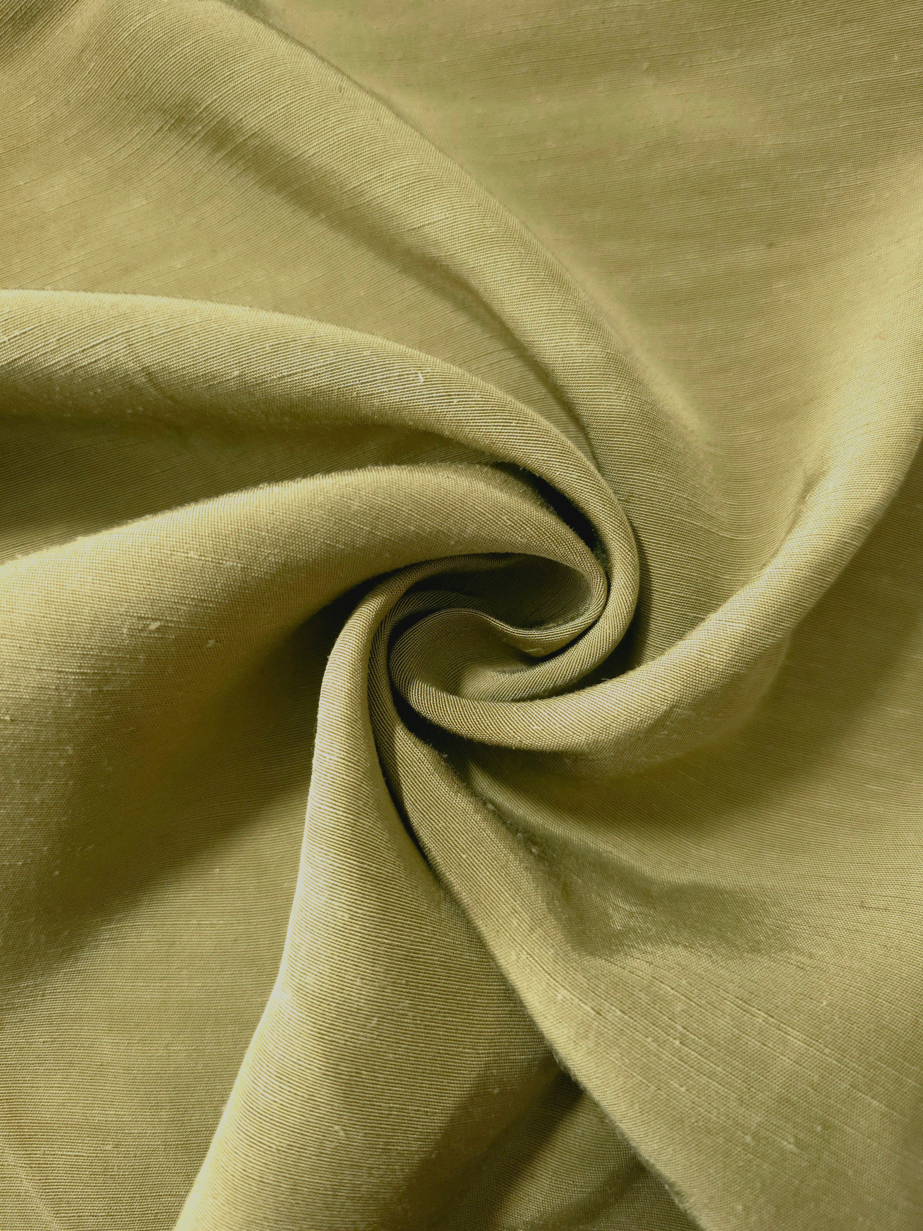 Fresh apple green linen viscose plain fabric styled for modestwear, with a matte, soft-touch finish.