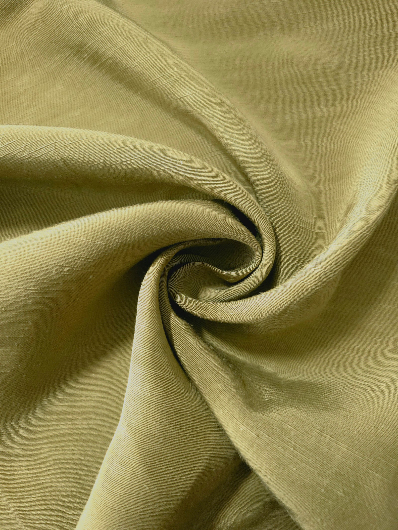 Fresh apple green linen viscose plain fabric styled for modestwear, with a matte, soft-touch finish.