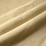 Texture view of soft baby yellow linen viscose plain fabric highlighting its flowy, breathable finish.