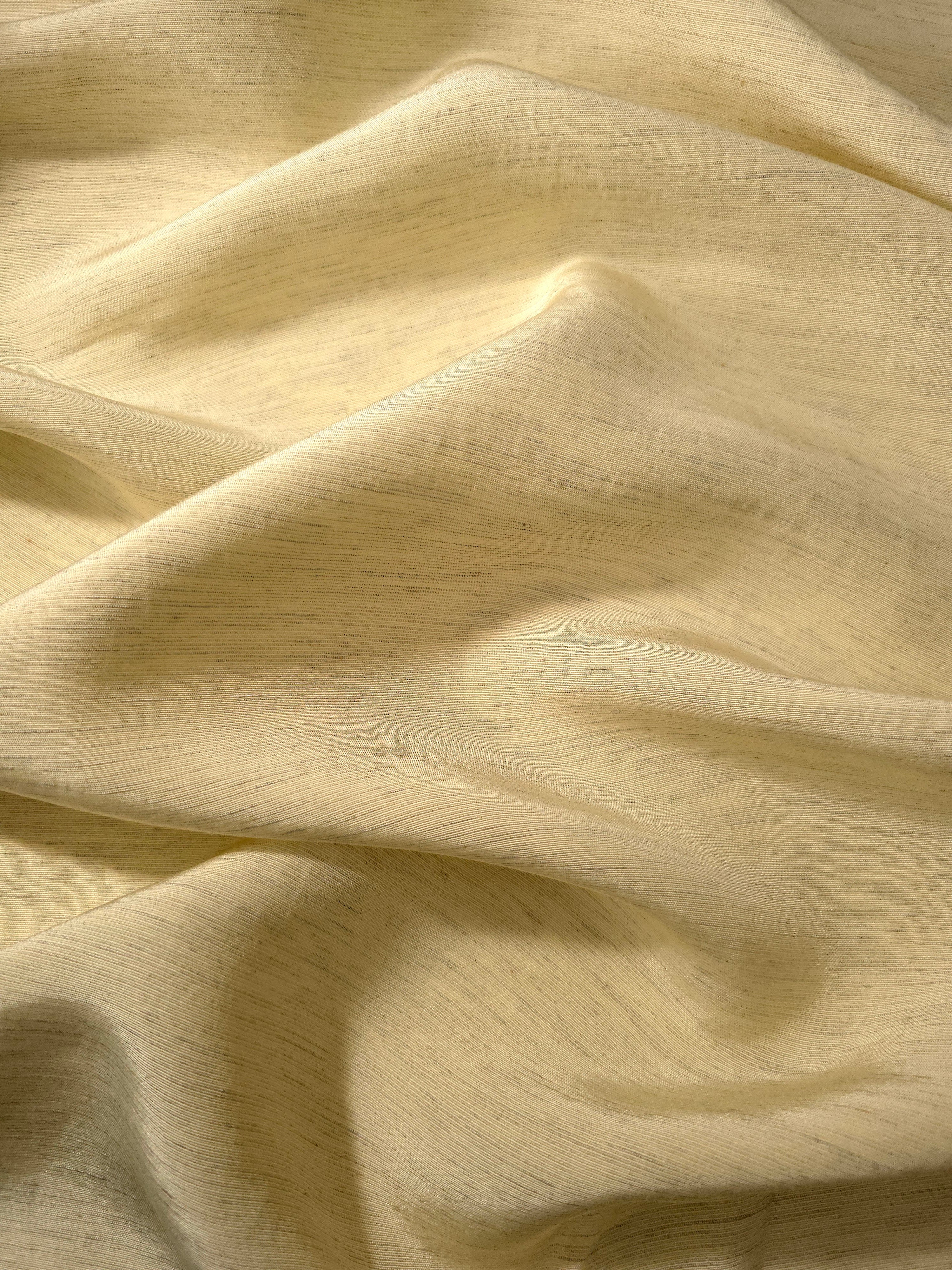 Soft baby yellow linen viscose plain fabric styled for modestwear, with a matte, soft-touch finish.