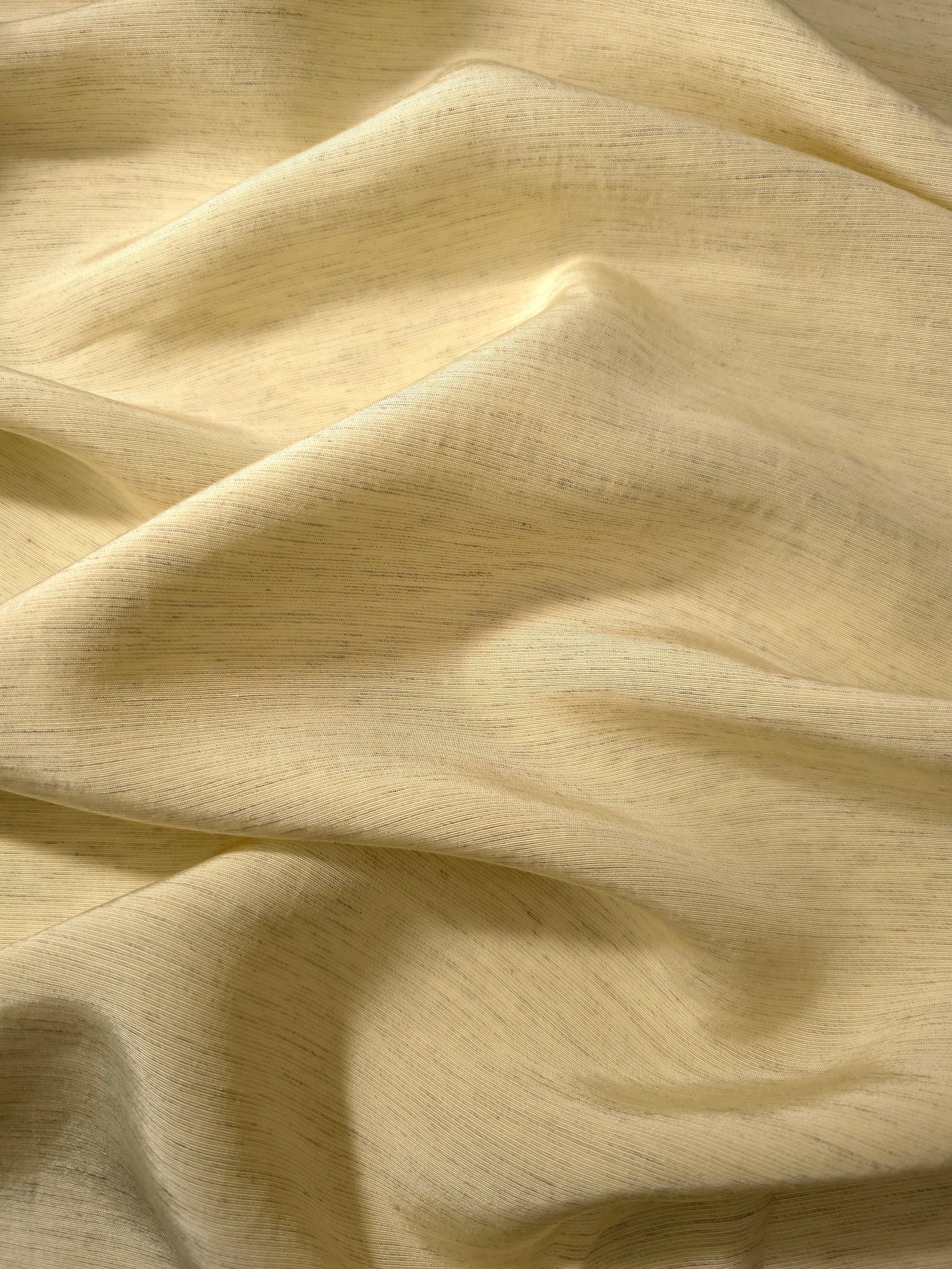 Soft baby yellow linen viscose plain fabric styled for modestwear, with a matte, soft-touch finish.