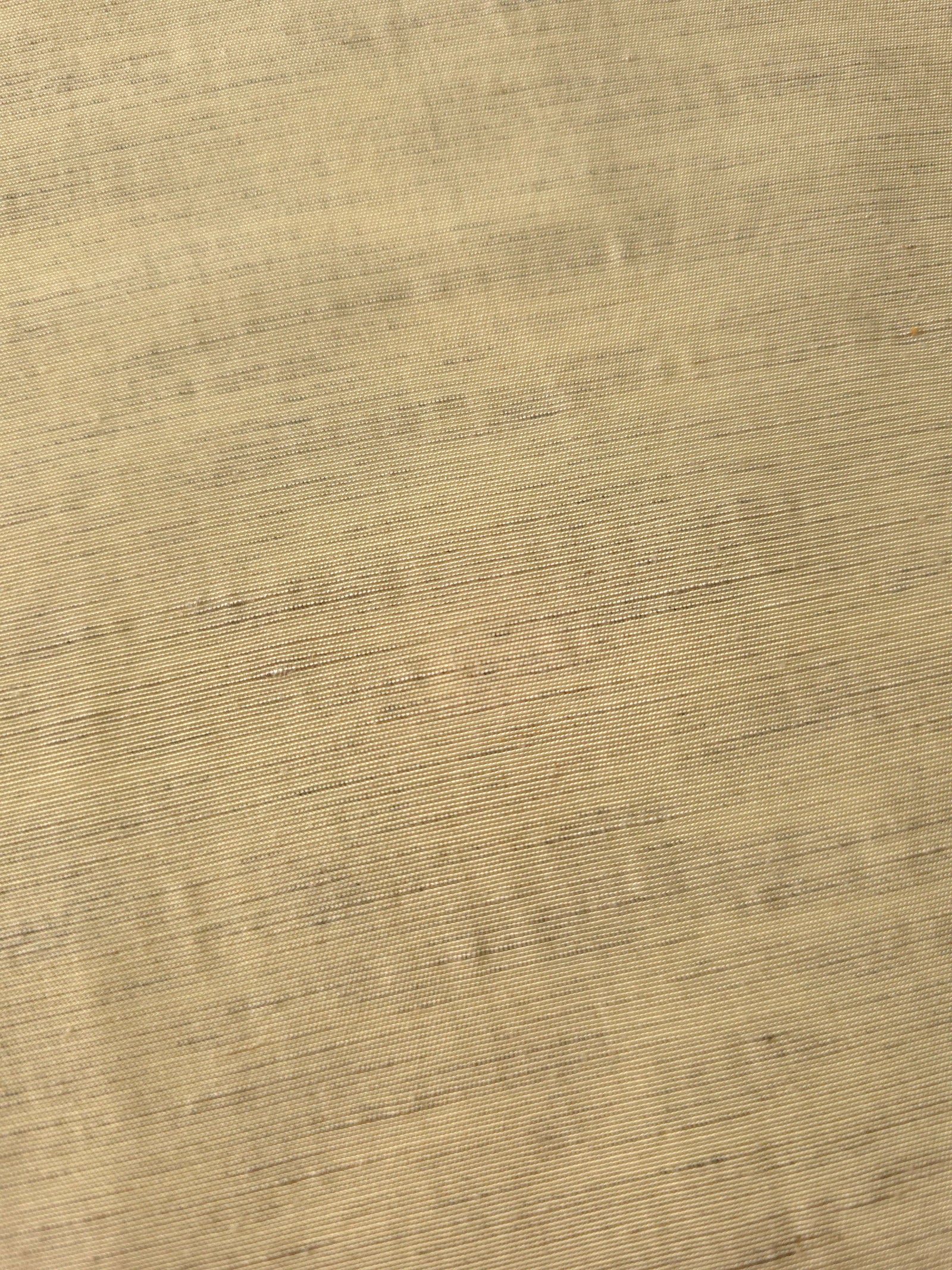 Soft baby yellow linen viscose plain fabric draped to show its soft structure, ideal for dressmaking.