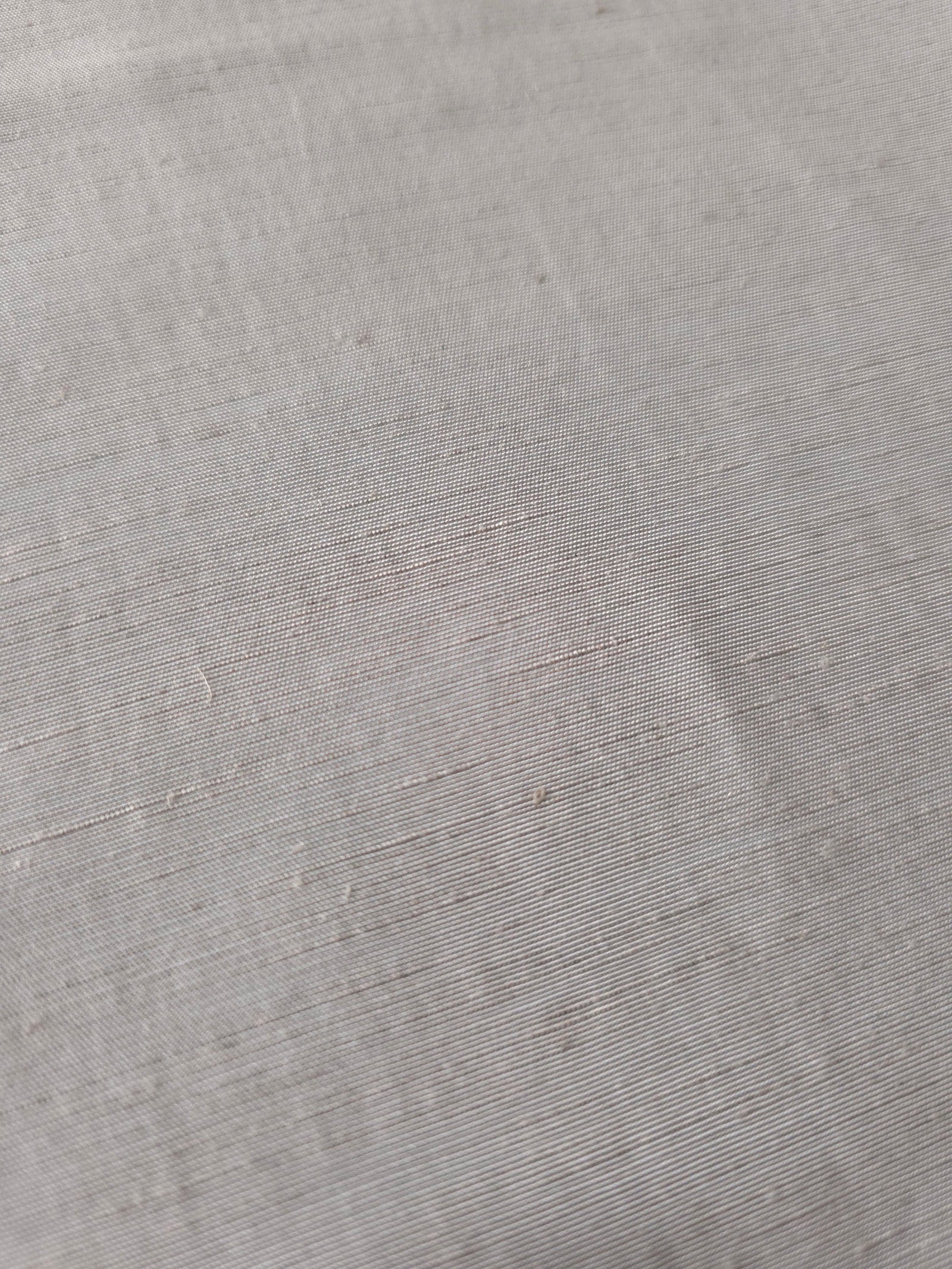 Soft pearl grey plain-weave linen viscose fabric, prized for its breathable hand and everyday apparel use.