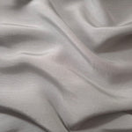 Soft pearl grey linen viscose plain fabric shown styled for abaya and modestwear designs.
