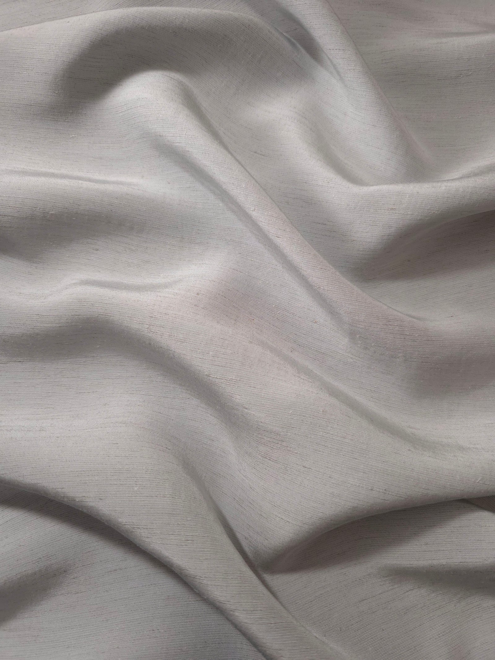 Soft pearl grey linen viscose plain fabric shown styled for abaya and modestwear designs.