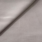 Macro detail of soft pearl grey linen viscose plain fabric, highlighting the plain weave's natural grain.