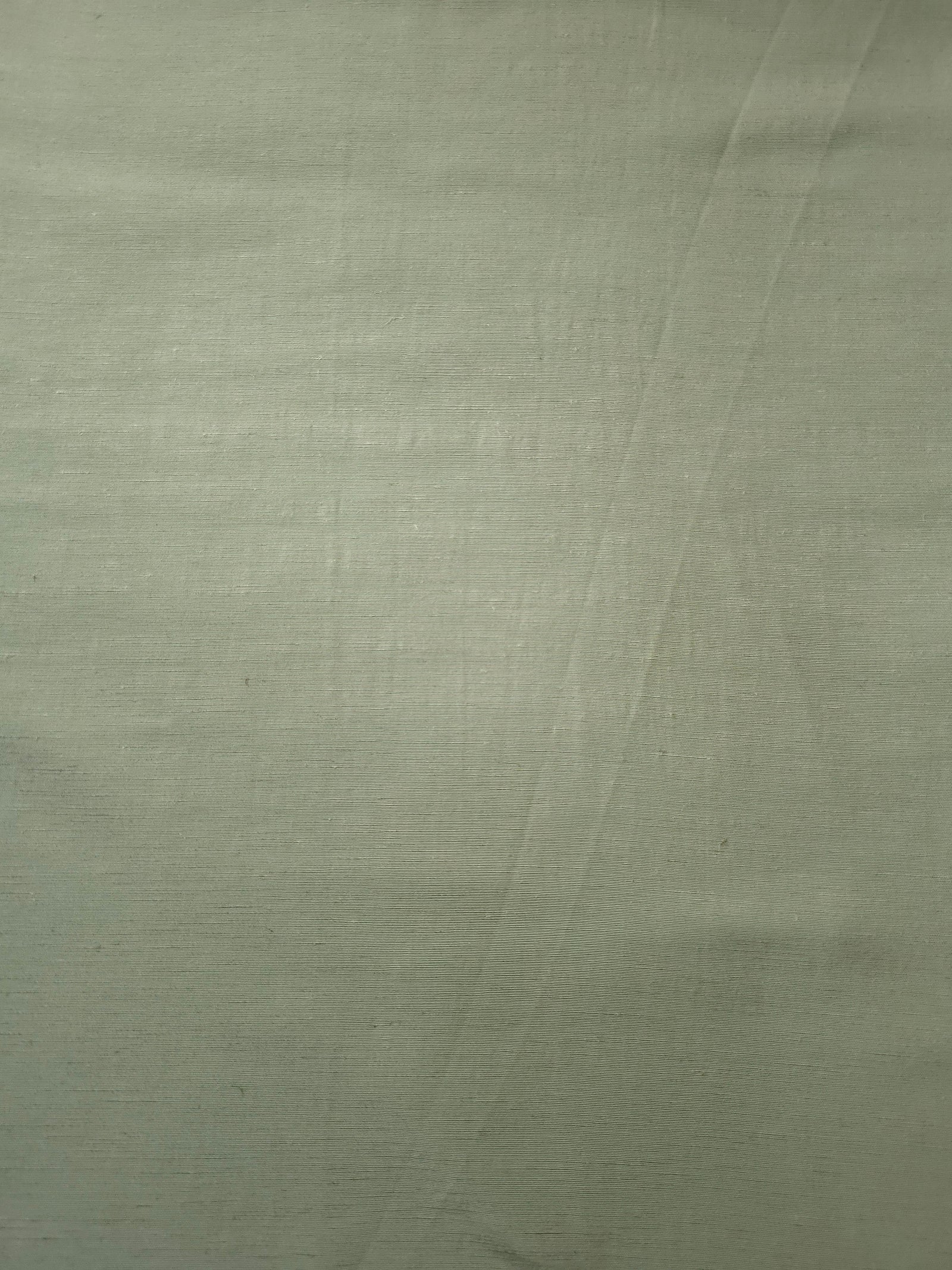 Muted sage grey linen viscose plain fabric with a smooth, breathable weave suited for warm-weather apparel.
