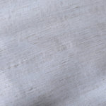 Texture view of cool grey-blue linen viscose plain fabric highlighting its flowy, breathable finish.