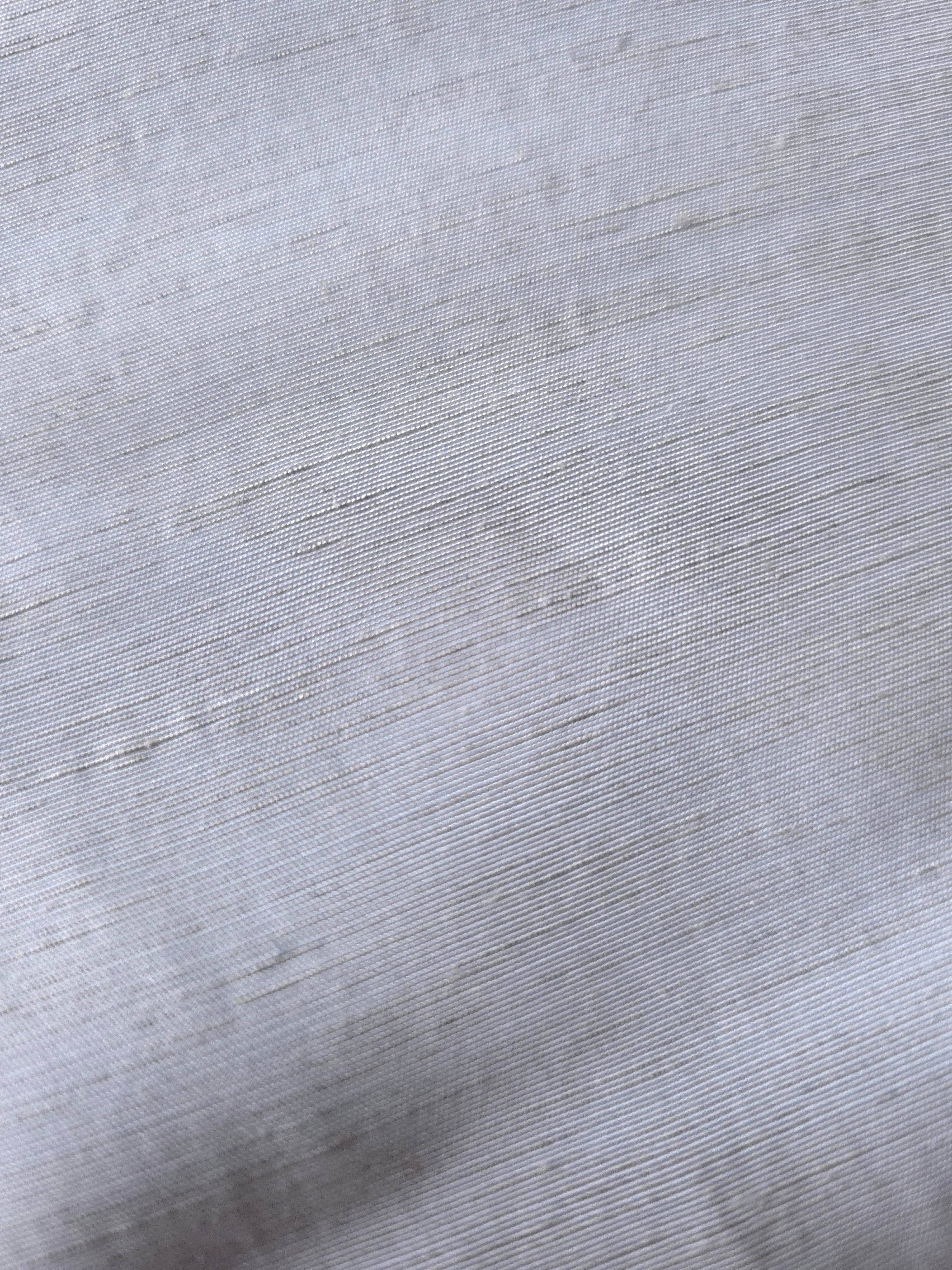 Texture view of cool grey-blue linen viscose plain fabric highlighting its flowy, breathable finish.