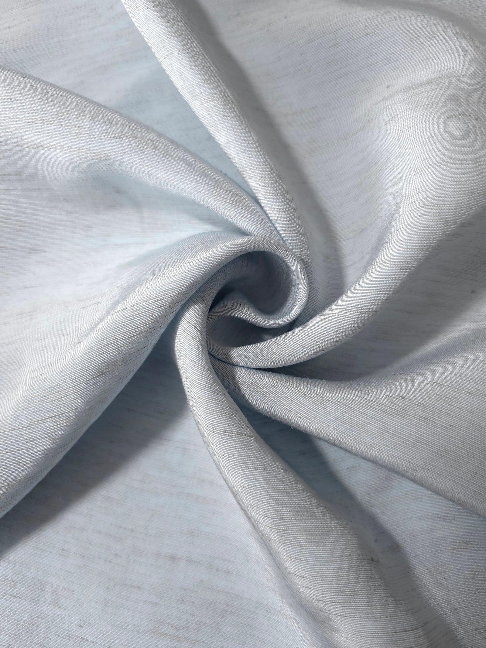 Cool grey-blue linen viscose plain fabric styled for modestwear, with a matte, soft-touch finish.