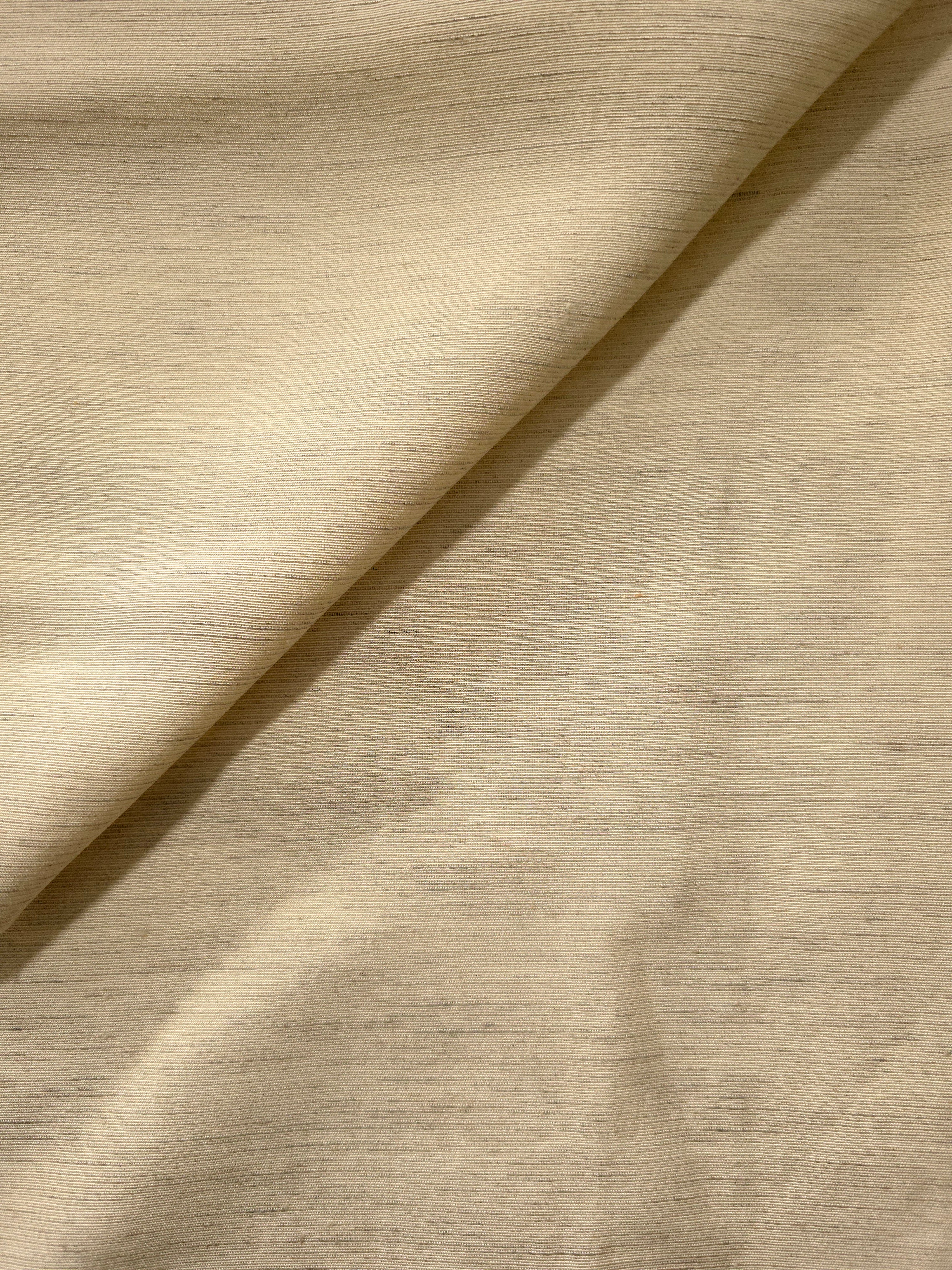Soft cream linen viscose plain fabric with a smooth, breathable weave suited for warm-weather apparel.