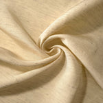 Soft cream linen viscose plain fabric folded to show its lightweight, garment-ready texture.