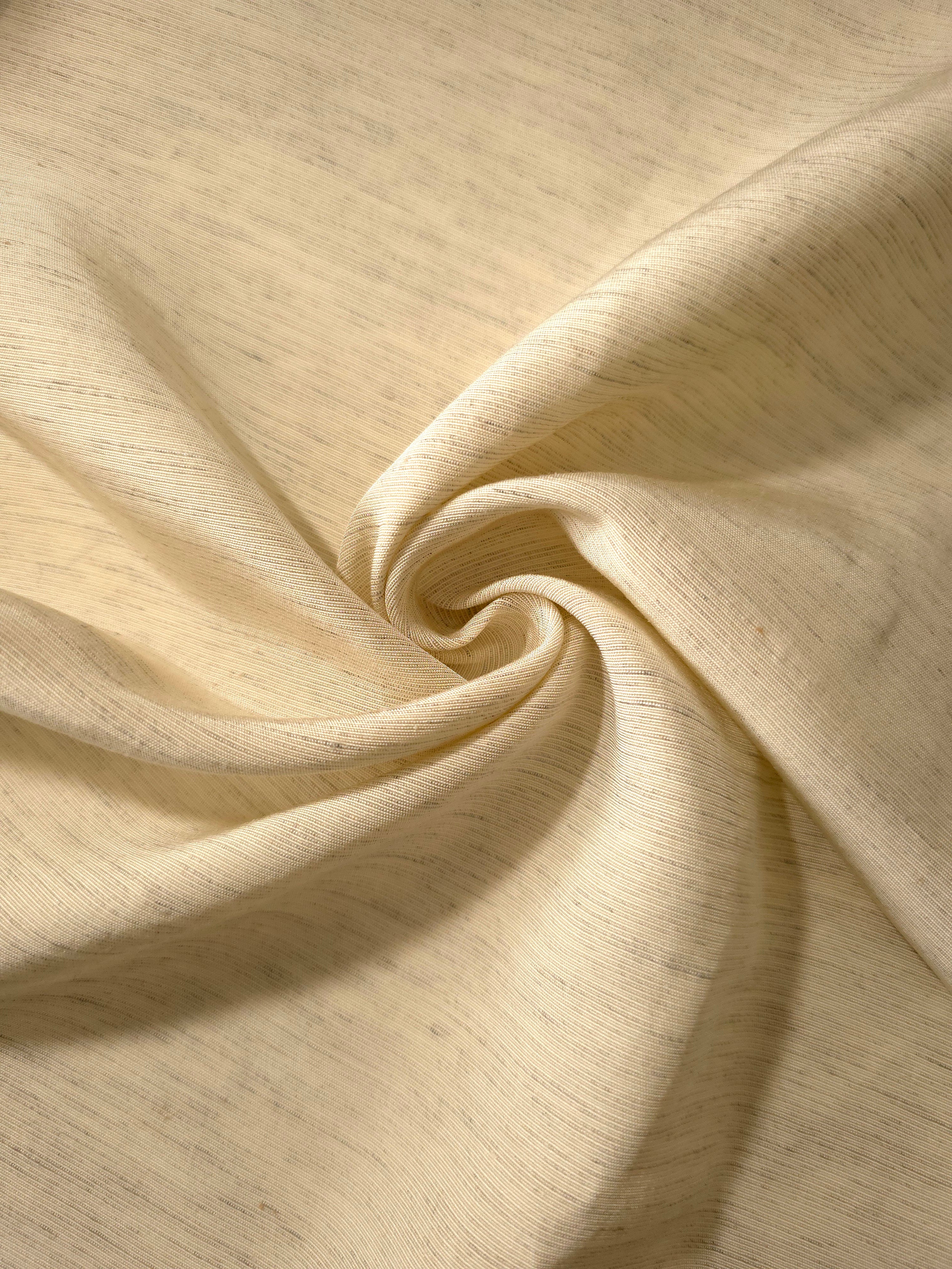 Soft cream linen viscose plain fabric folded to show its lightweight, garment-ready texture.