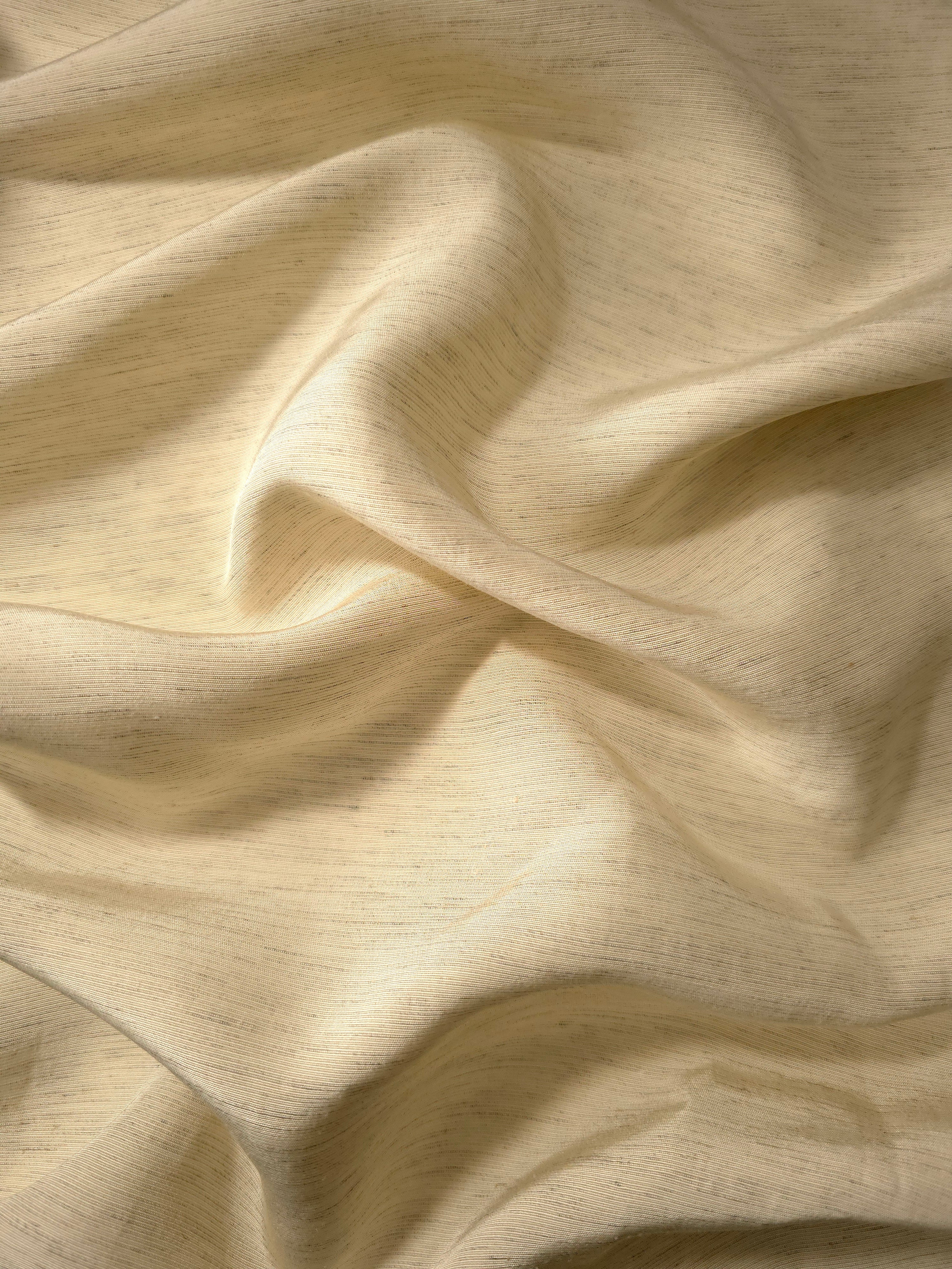 Soft cream linen viscose plain fabric styled for modestwear, with a matte, soft-touch finish.