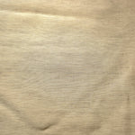 Close-up of soft cream linen viscose plain fabric showing its natural woven texture.