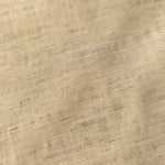 Soft cream linen viscose plain fabric draped to show its soft structure, ideal for dressmaking.