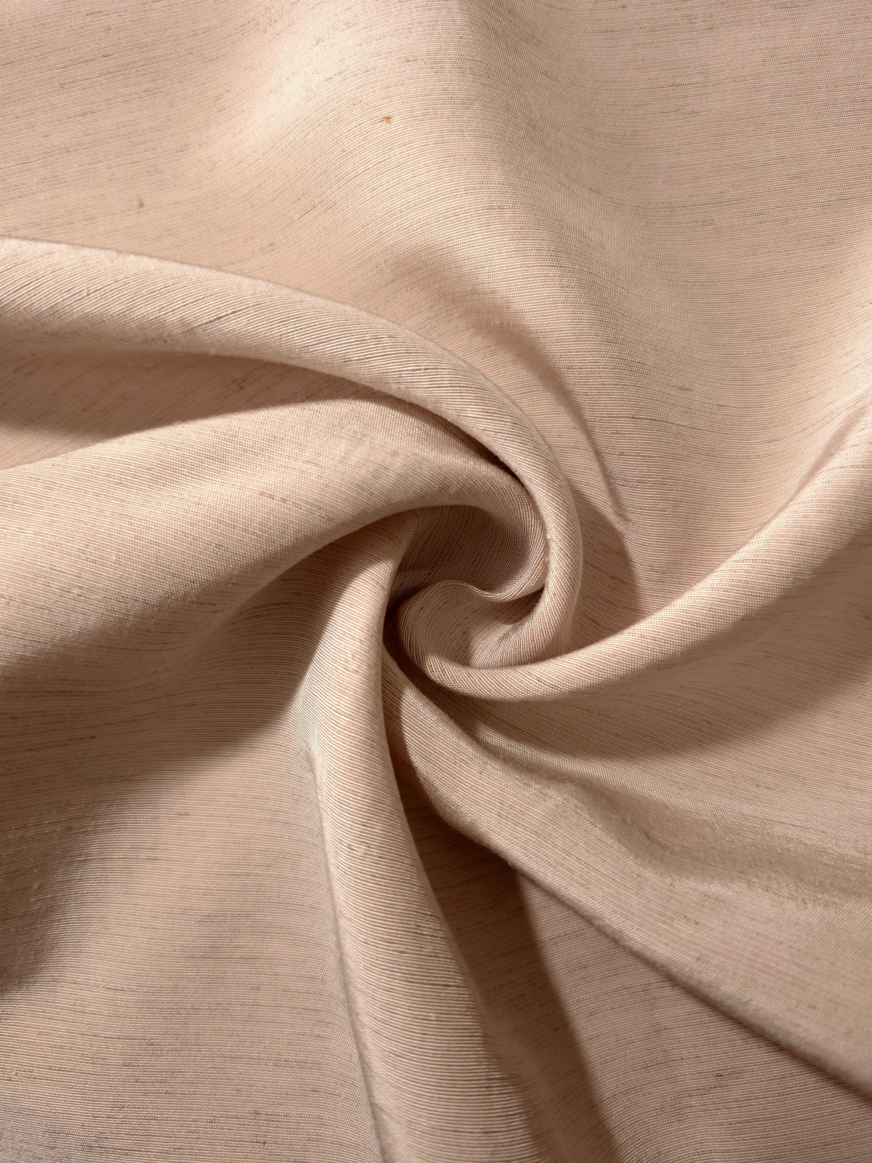 Warm sandy beige linen viscose plain fabric styled for modestwear, with a matte, soft-touch finish.