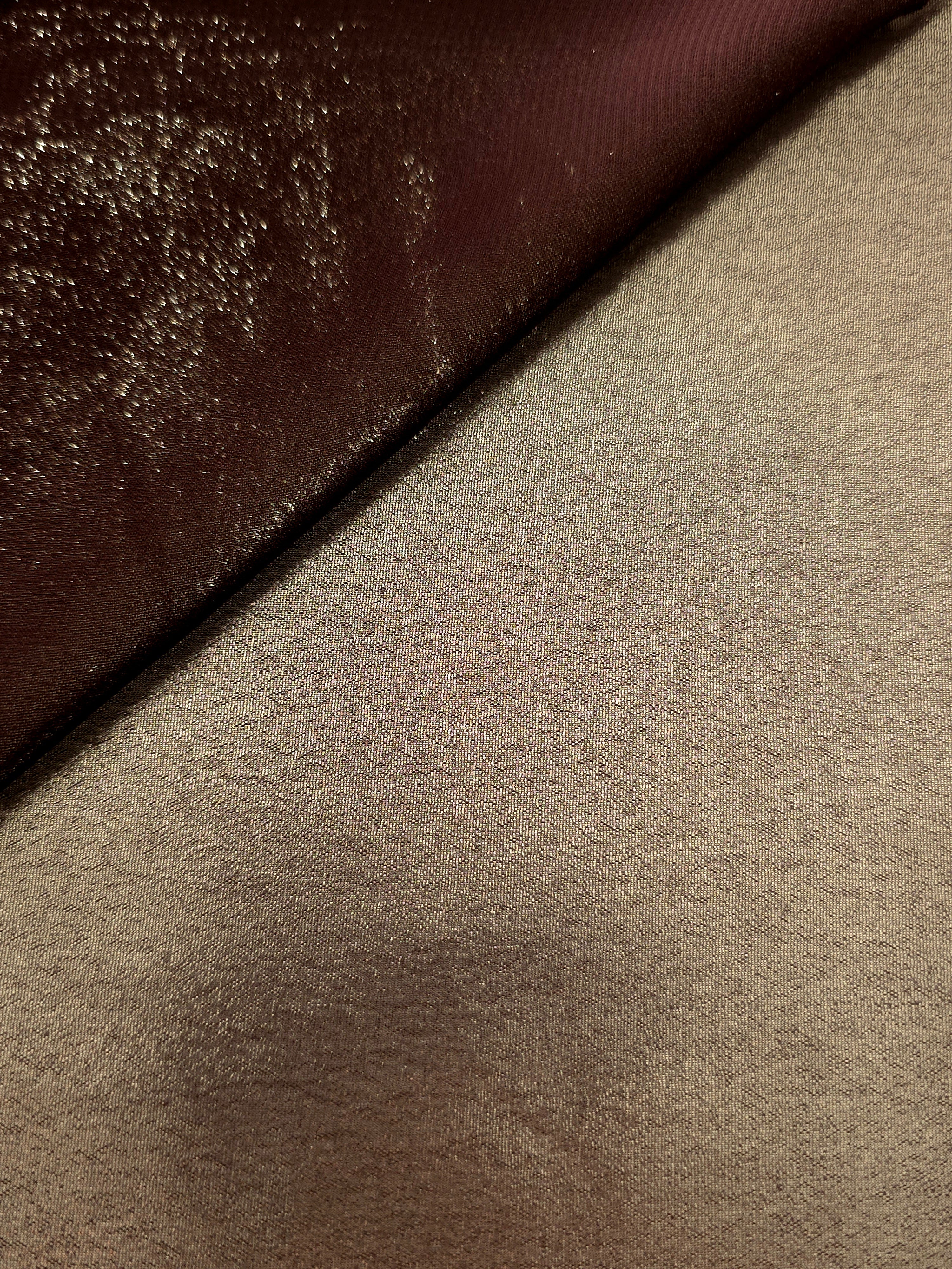 Copper glow soft draping view of liquid metallic shimmer chiffon fabric, highlighting fluid folds and reflective surface