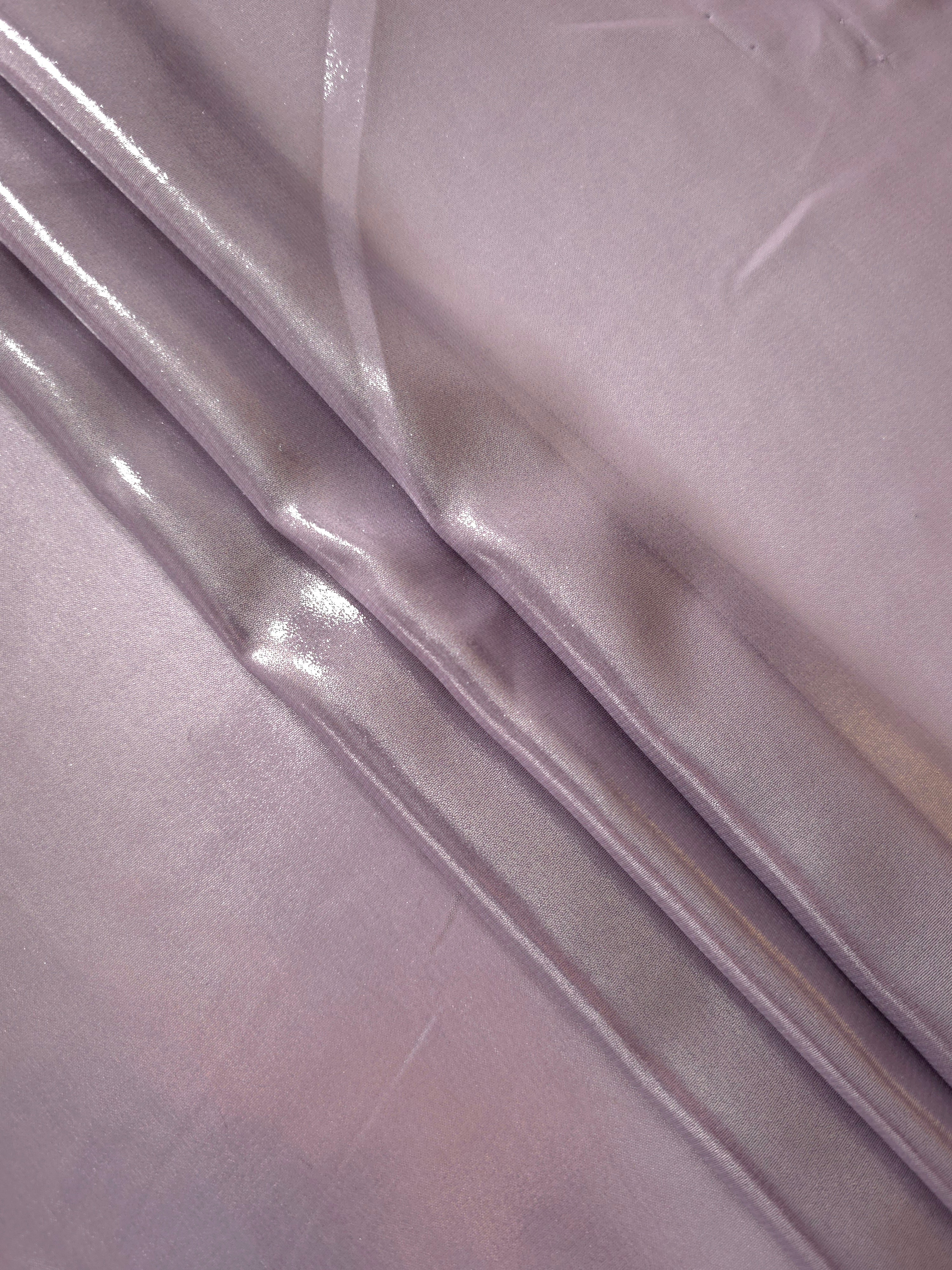 Dusty lilac flowing folds of liquid metallic shimmer chiffon fabric, showing lightweight reflective fabric texture and drape