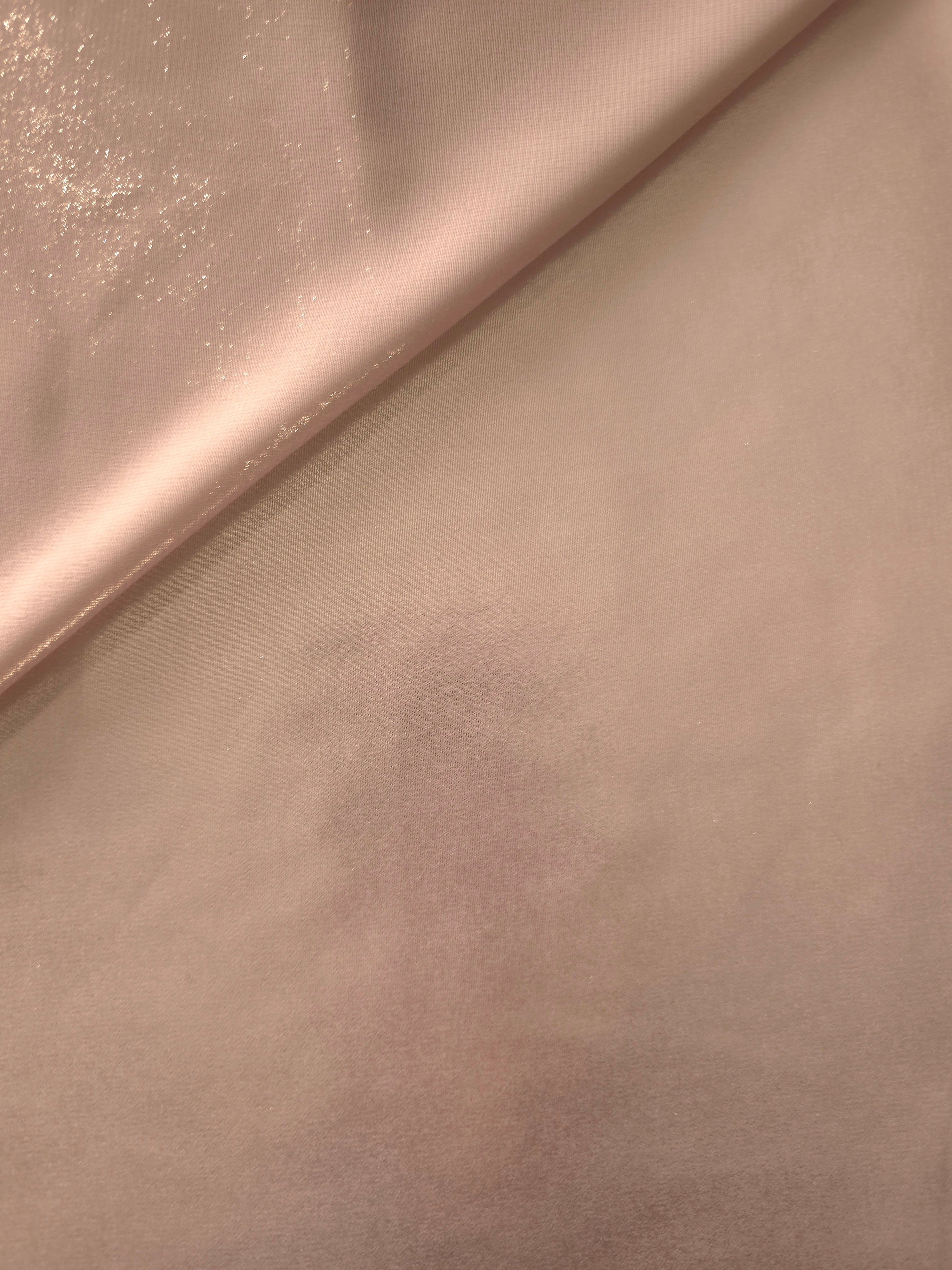 Dusty rose soft draping of liquid metallic shimmer chiffon fabric, showing lightweight reflective fabric texture and drape