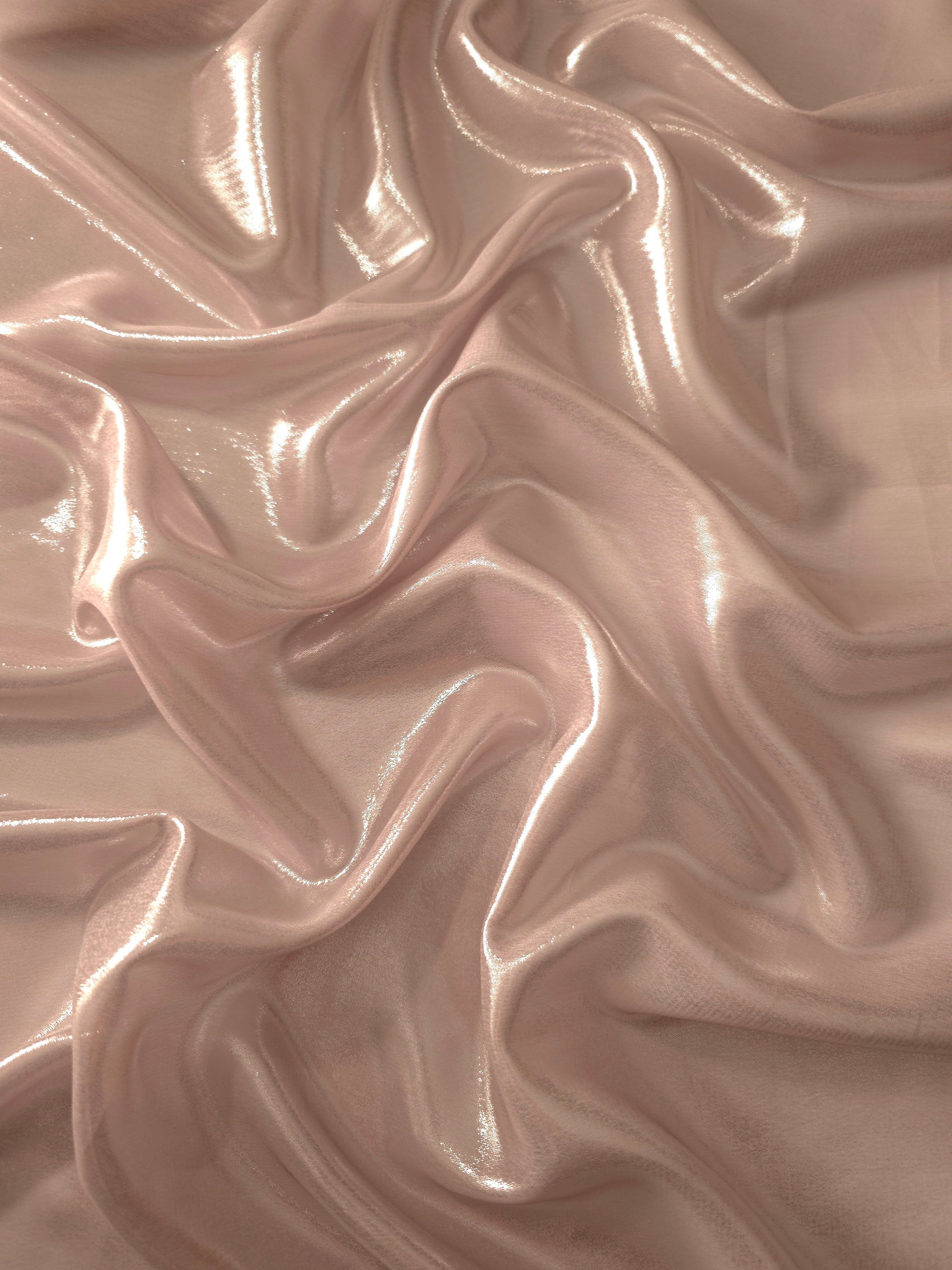 Mauve haze surface detail of liquid metallic shimmer chiffon fabric, showing lightweight reflective fabric texture and drape