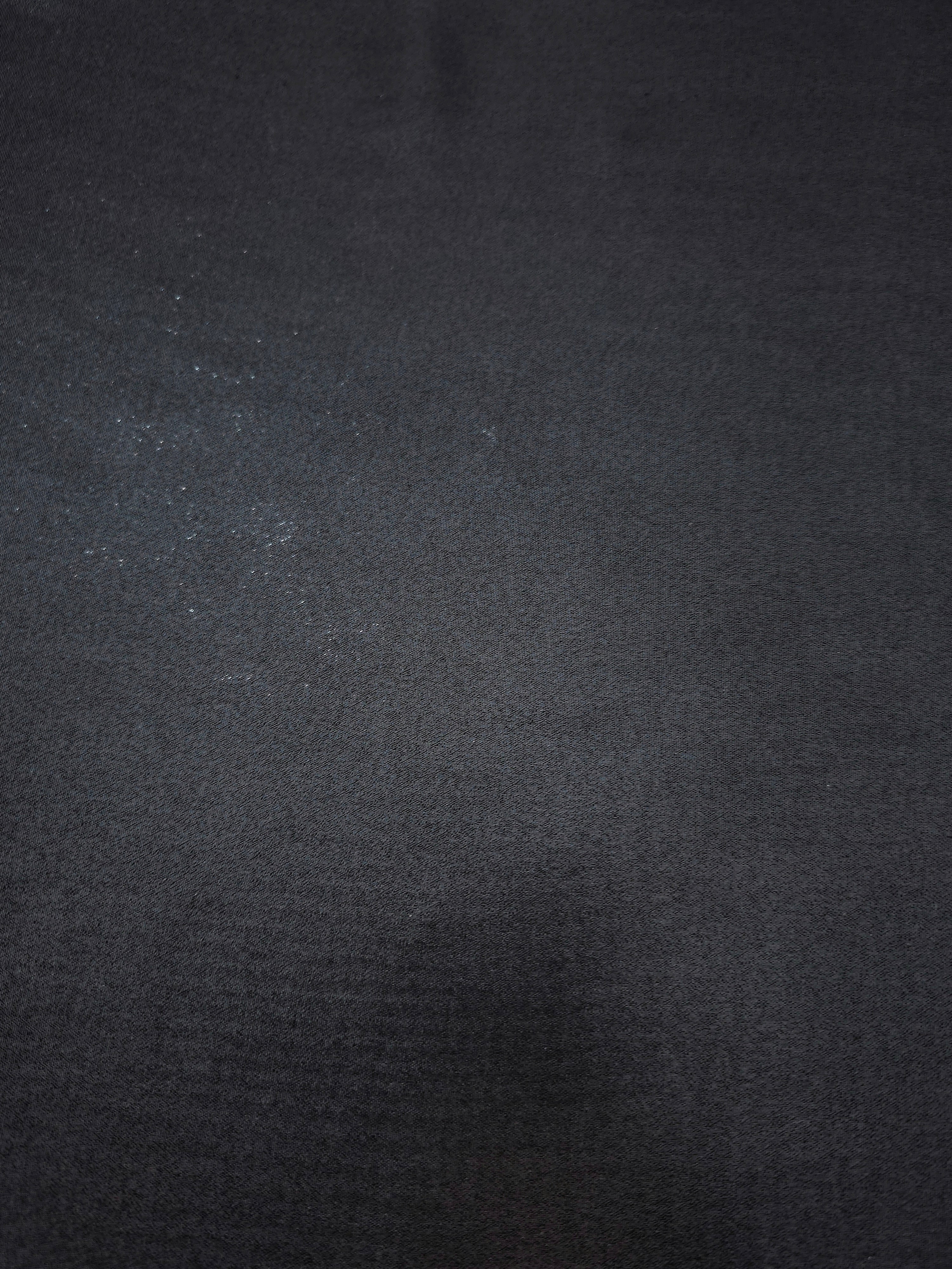 Midnight navy fabric overview view of liquid metallic shimmer chiffon fabric, highlighting fluid folds and reflective surface