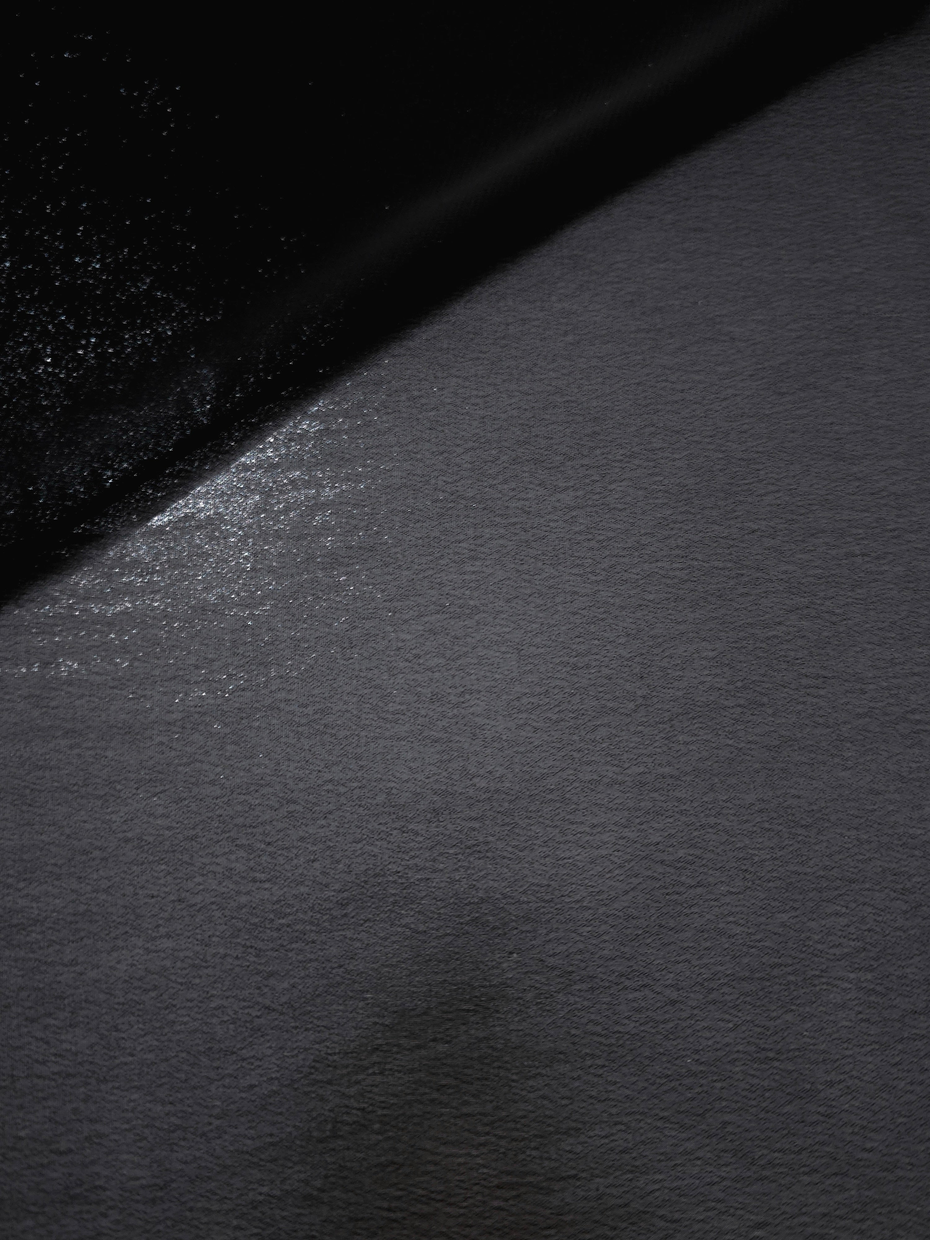Midnight navy soft draping view of liquid metallic shimmer chiffon fabric, highlighting fluid folds and reflective surface