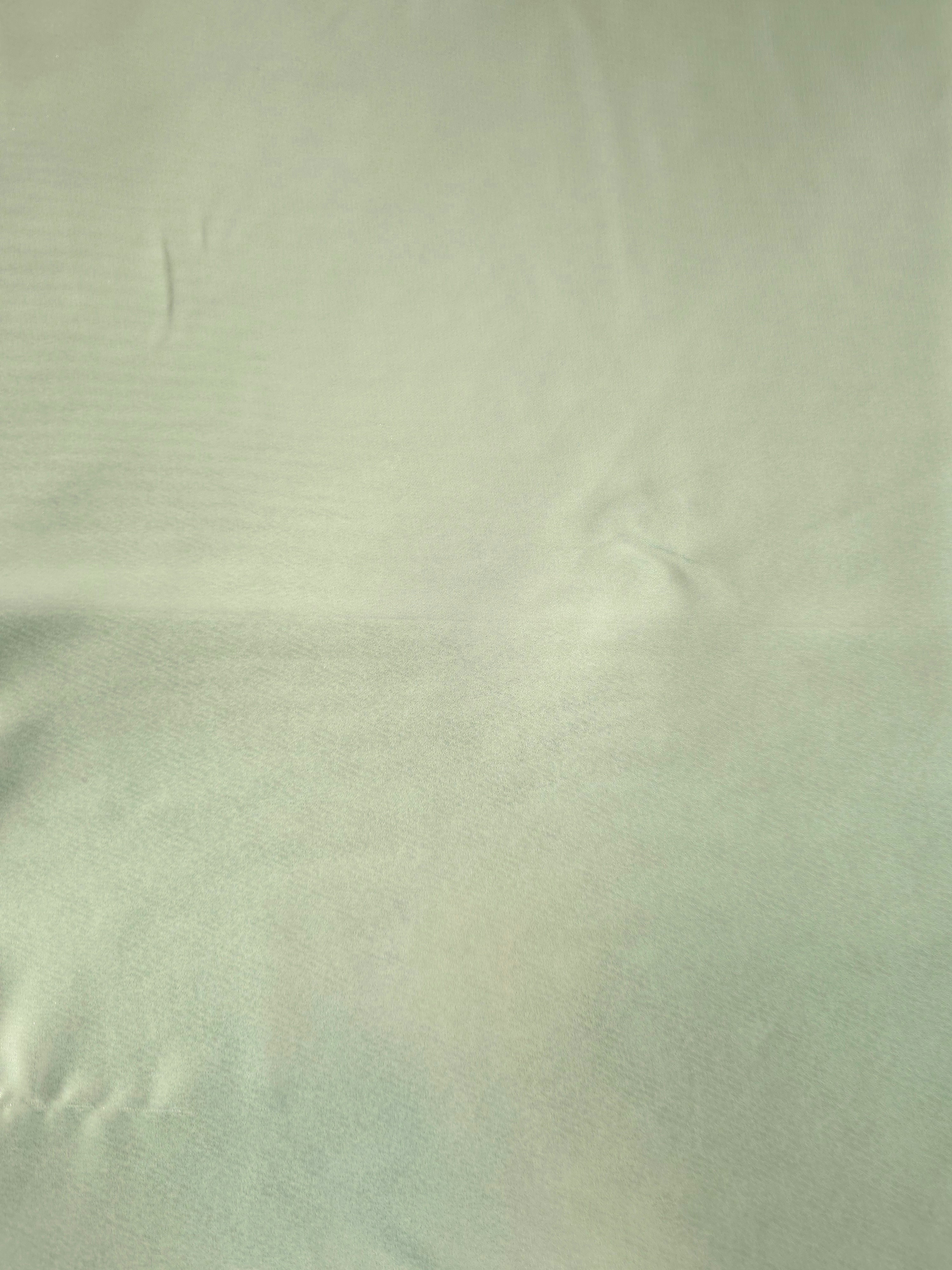 Mint frost fabric overview of liquid metallic shimmer chiffon fabric, showing lightweight reflective fabric texture and drape