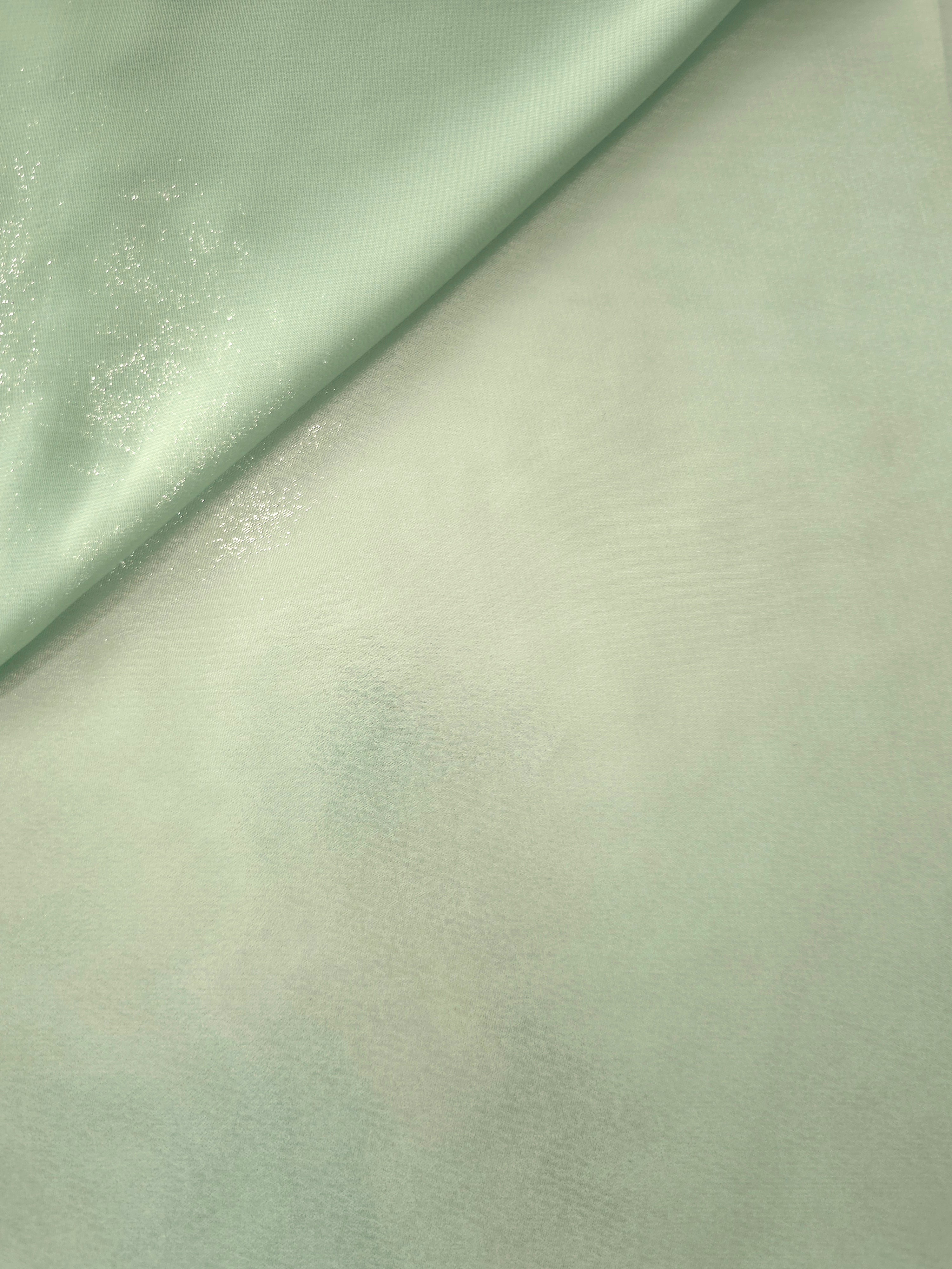 Mint frost soft draping of liquid metallic shimmer chiffon fabric, showing lightweight reflective fabric texture and drape