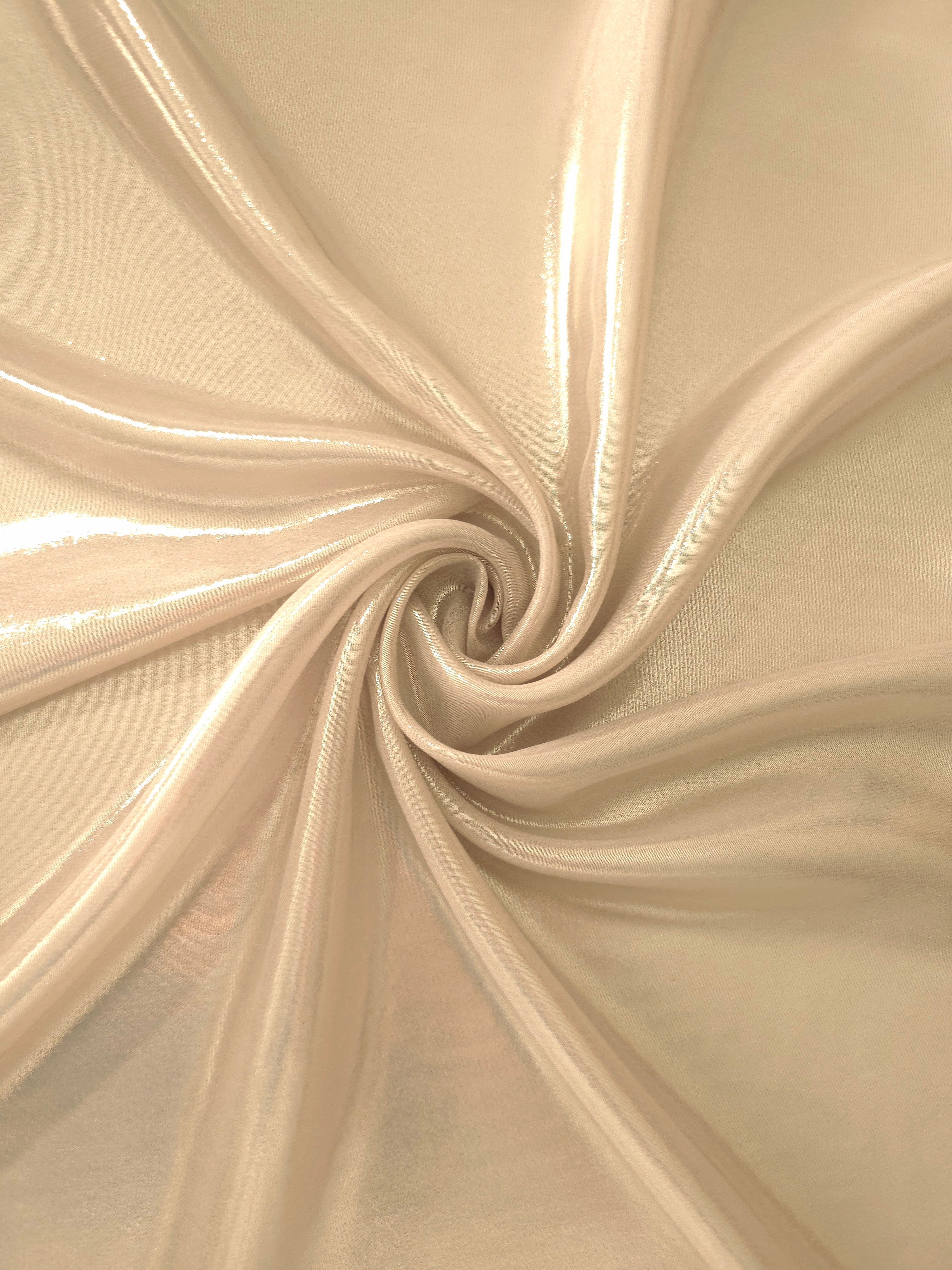 Nude champagne shimmer close-up of liquid metallic shimmer chiffon fabric, showing lightweight reflective fabric texture and drape