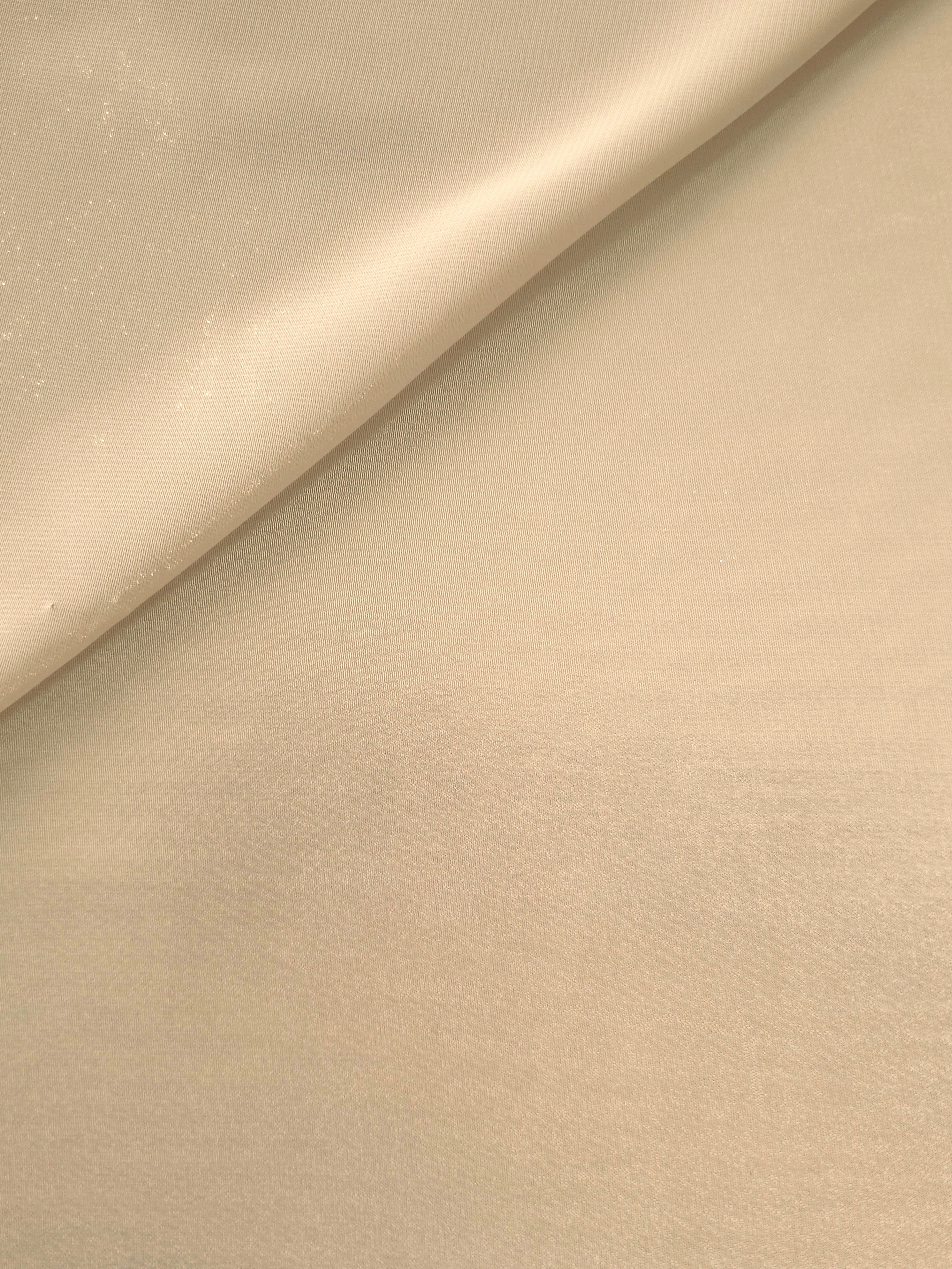 Nude champagne soft draping of liquid metallic shimmer chiffon fabric, showing lightweight reflective fabric texture and drape