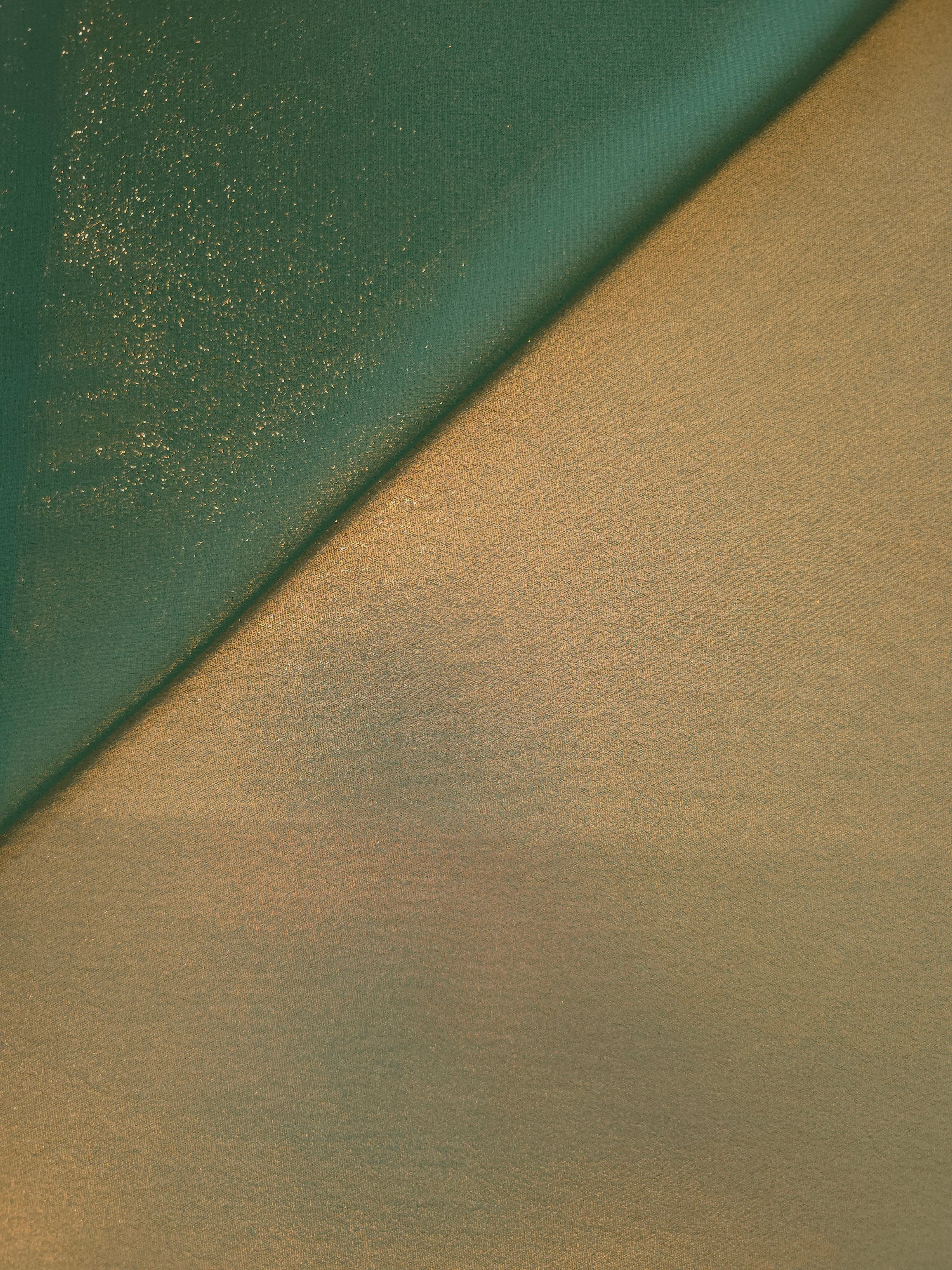 Olive gold soft draping view of liquid metallic shimmer chiffon fabric, highlighting fluid folds and reflective surface