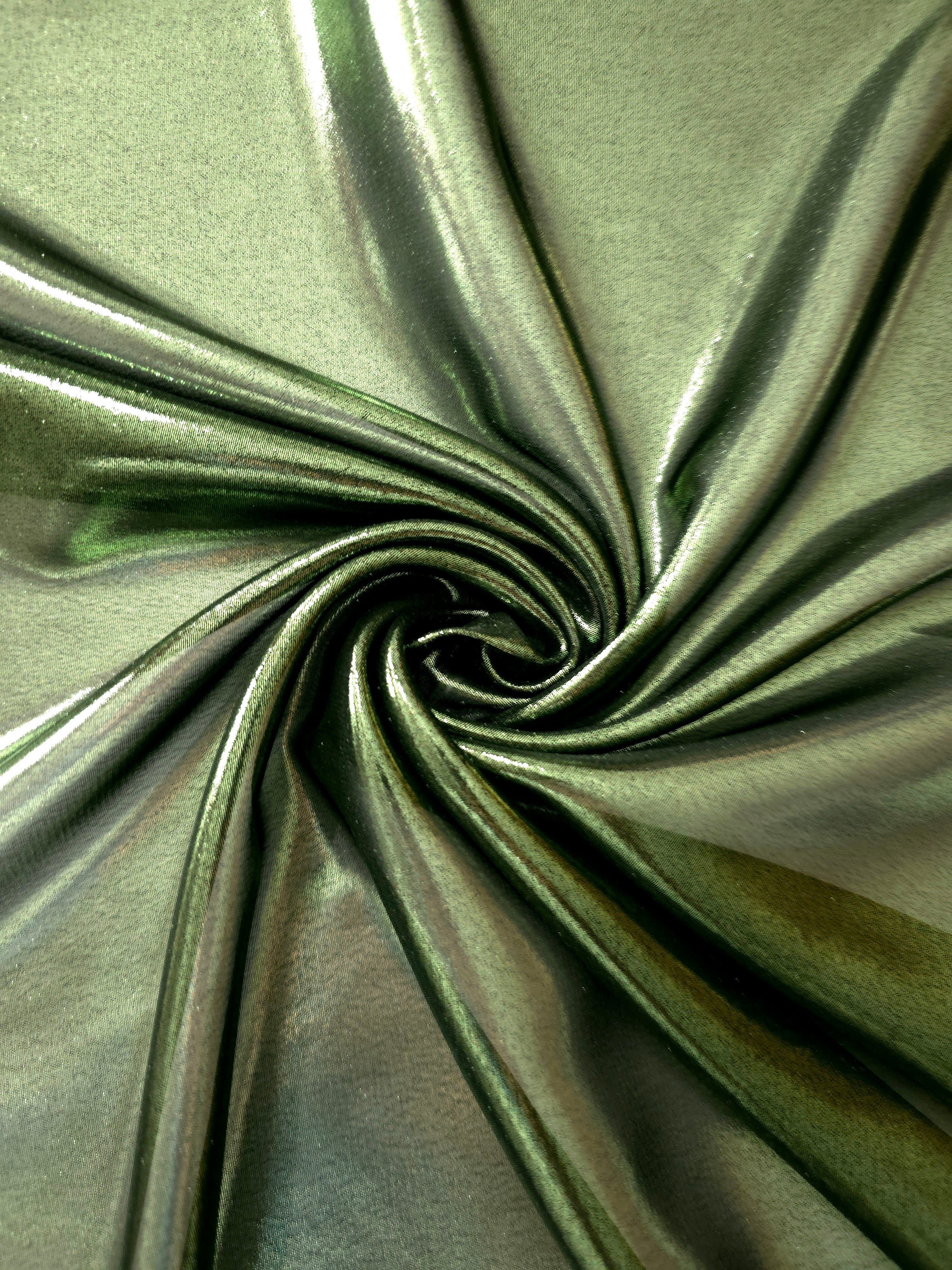 Olive green flowing folds view of liquid metallic shimmer chiffon fabric, highlighting fluid folds and reflective surface