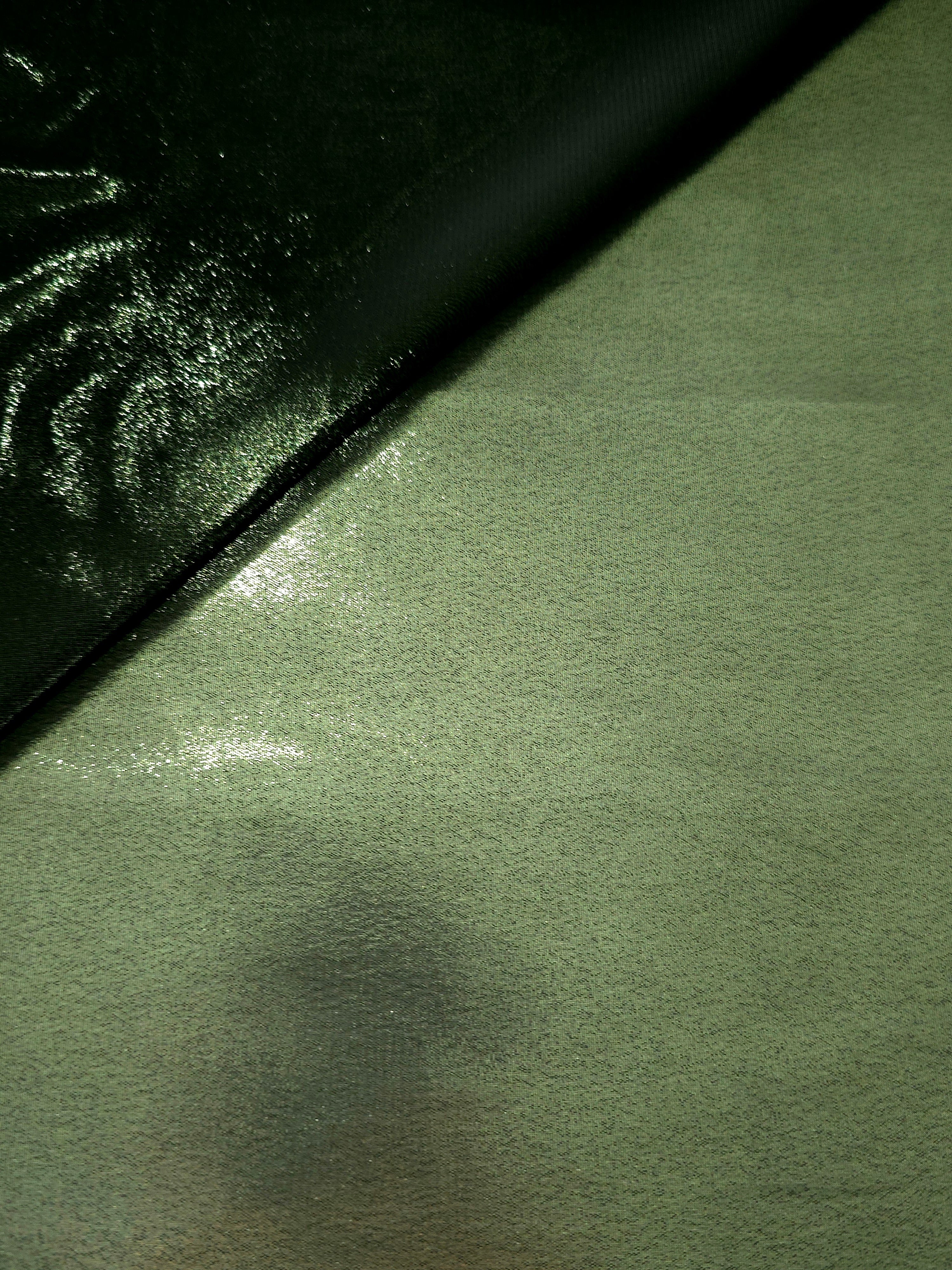 Olive green soft draping view of liquid metallic shimmer chiffon fabric, highlighting fluid folds and reflective surface
