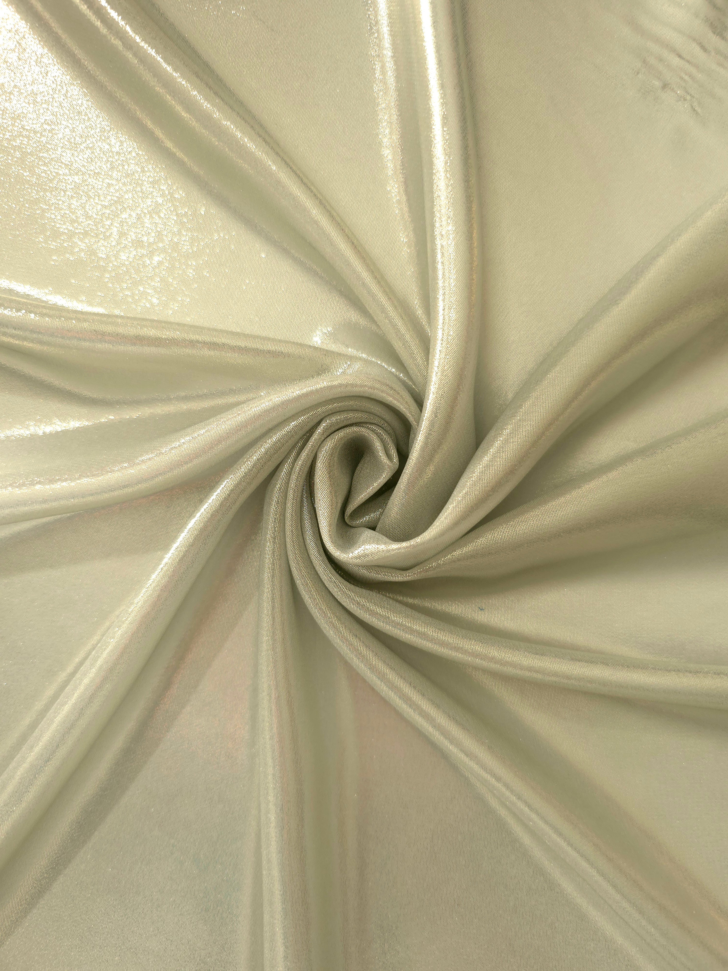 Pale pistachio shimmer close-up of liquid metallic shimmer chiffon fabric, showing lightweight reflective fabric texture and drape