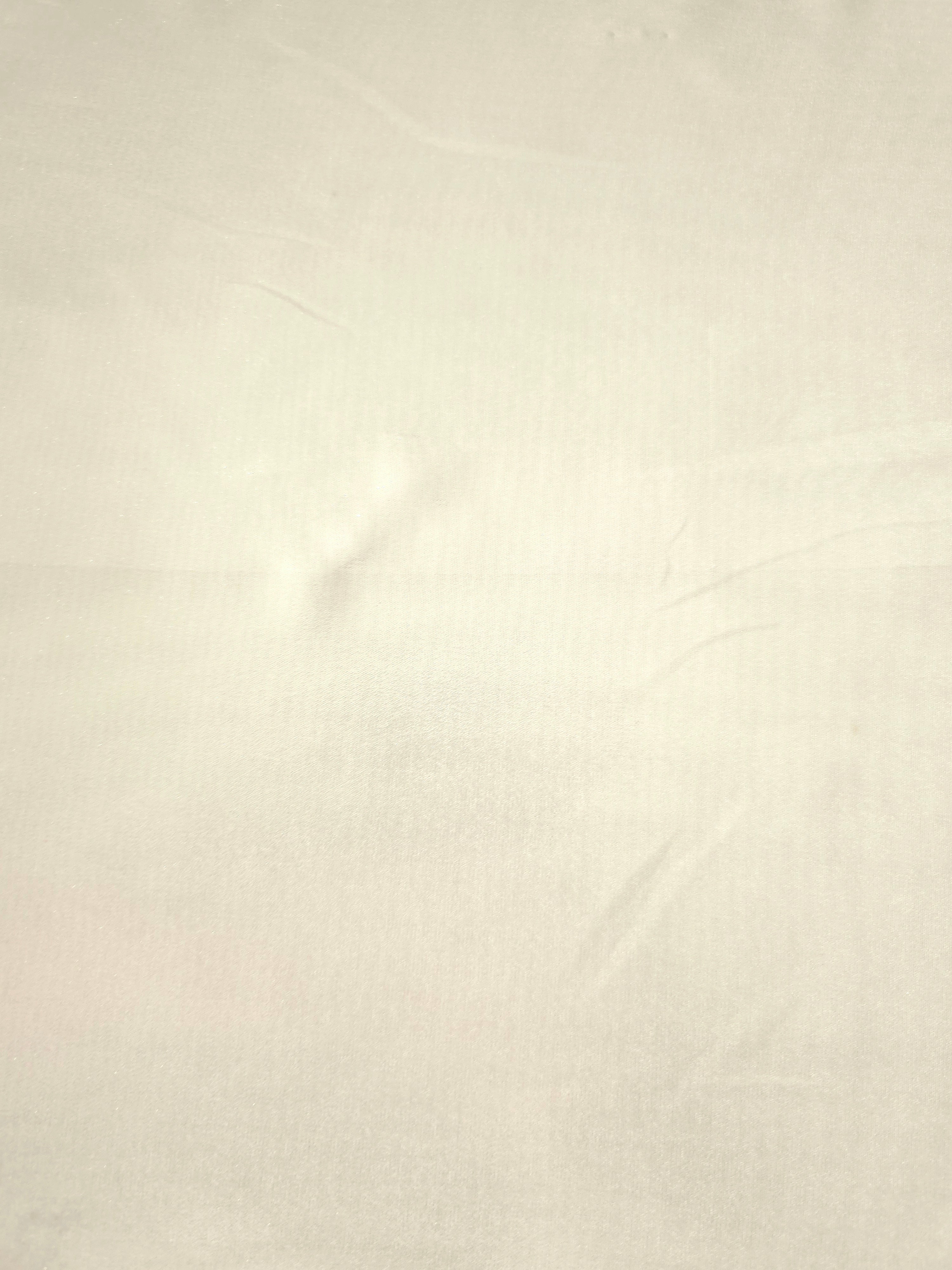 Pearl white fabric overview of liquid metallic shimmer chiffon fabric, showing lightweight reflective fabric texture and drape