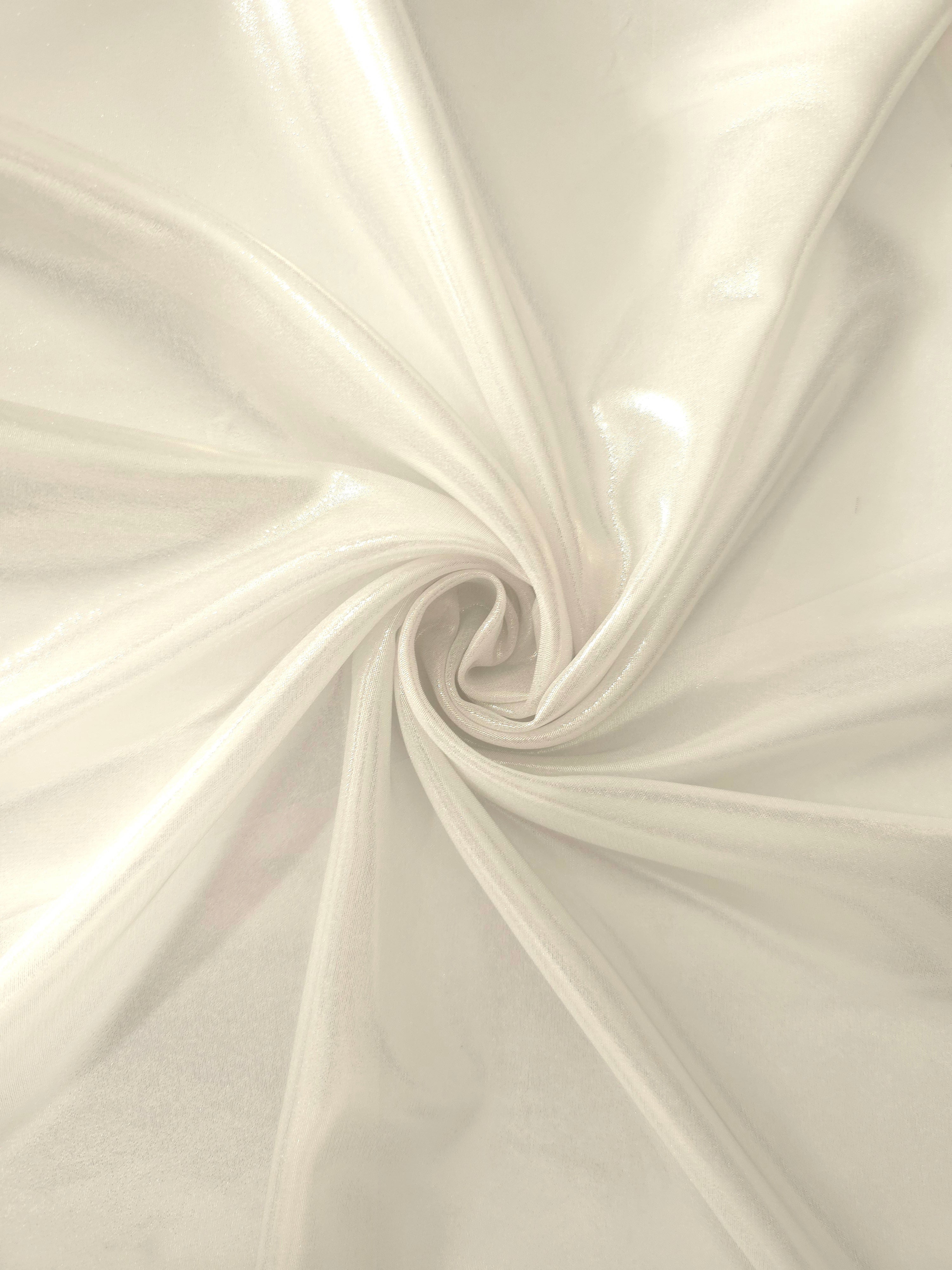 Pearl white shimmer close-up of liquid metallic shimmer chiffon fabric, showing lightweight reflective fabric texture and drape