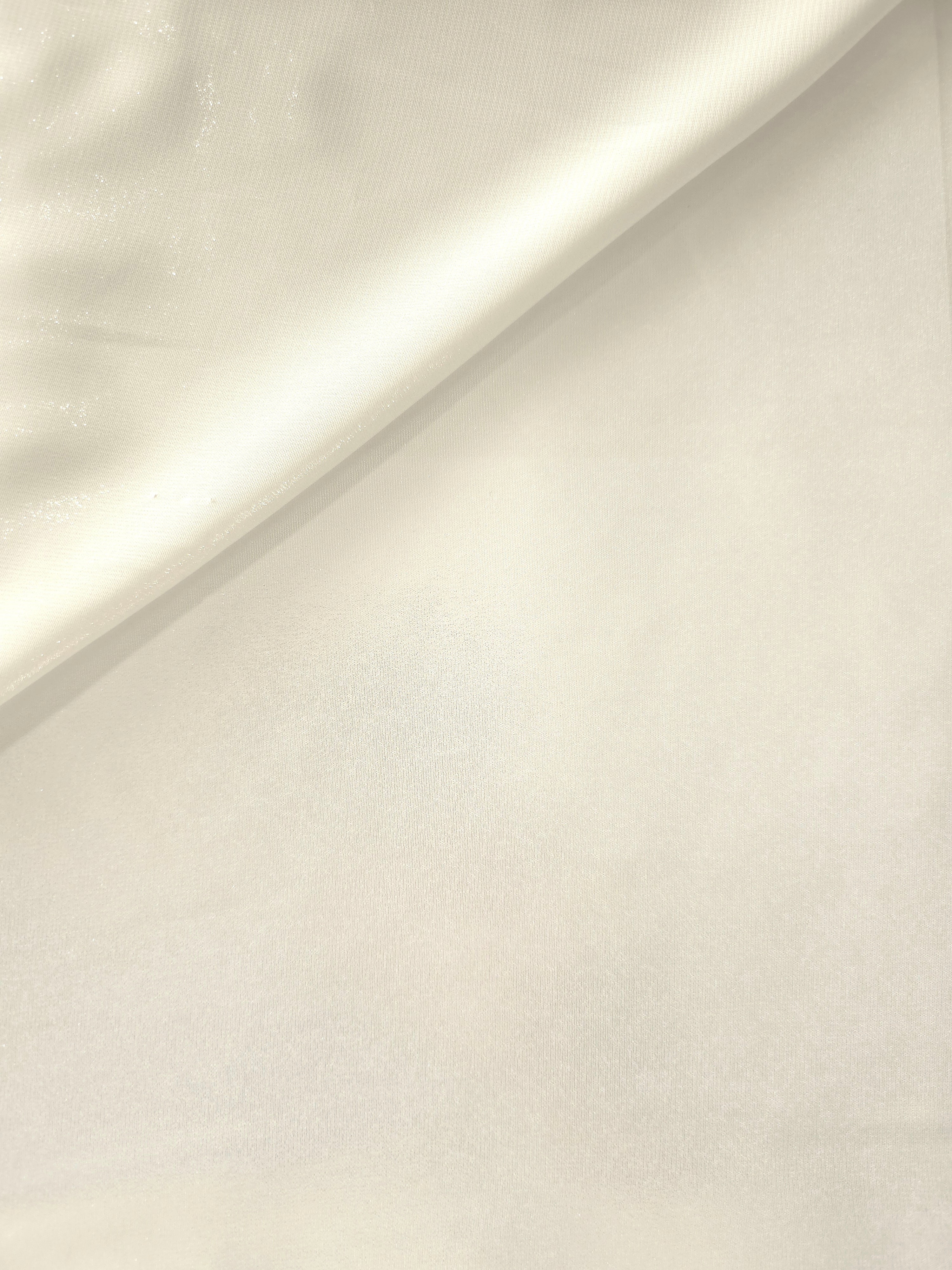 Pearl white soft draping of liquid metallic shimmer chiffon fabric, showing lightweight reflective fabric texture and drape