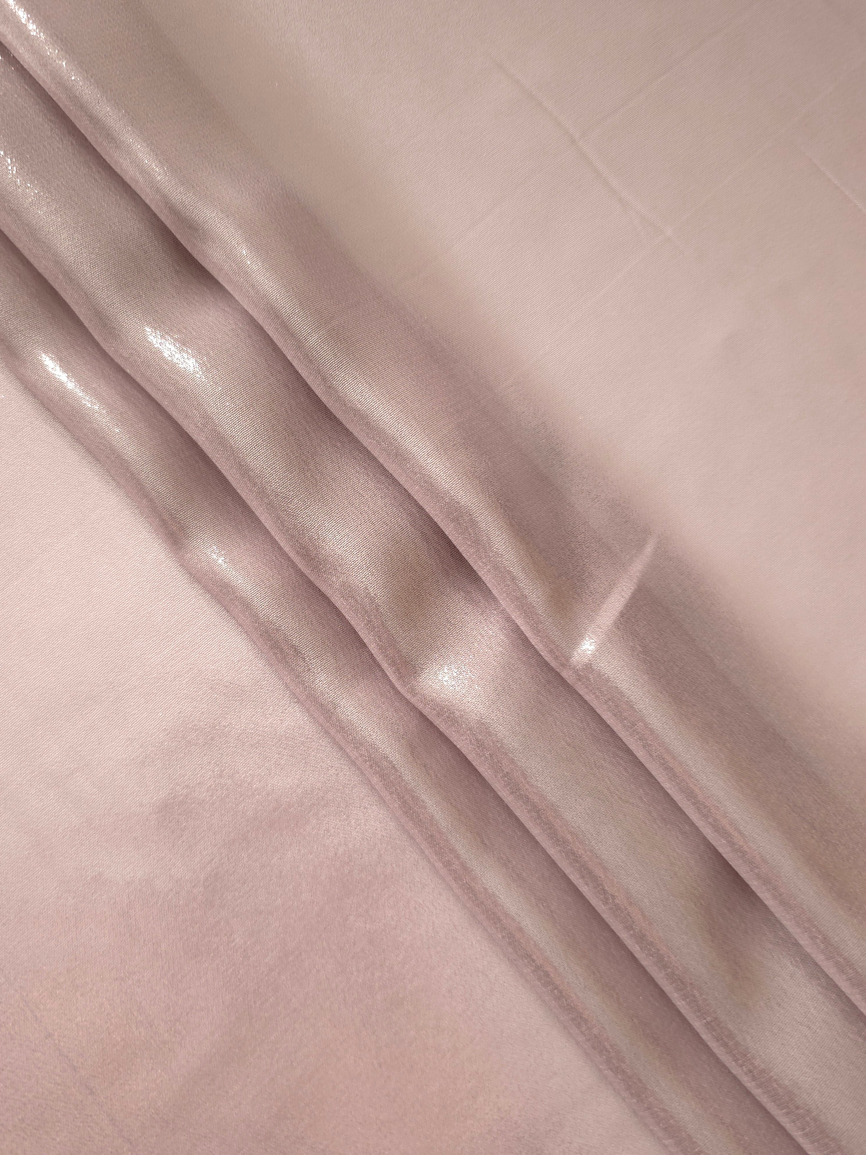 Rose blush flowing folds of liquid metallic shimmer chiffon fabric, showing lightweight reflective fabric texture and drape