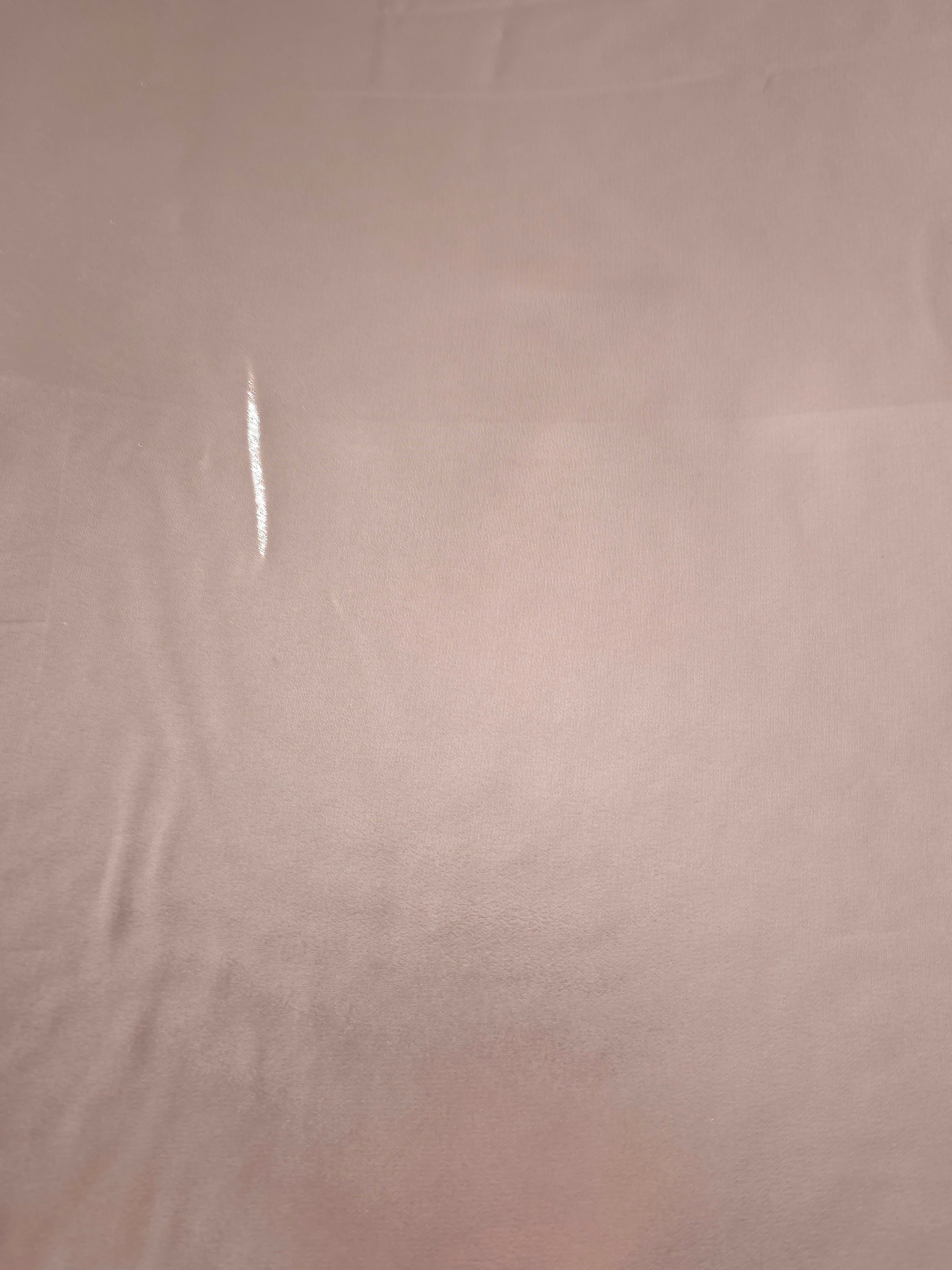 Rose blush shimmer detail of liquid metallic shimmer chiffon fabric, showing lightweight reflective fabric texture and drape