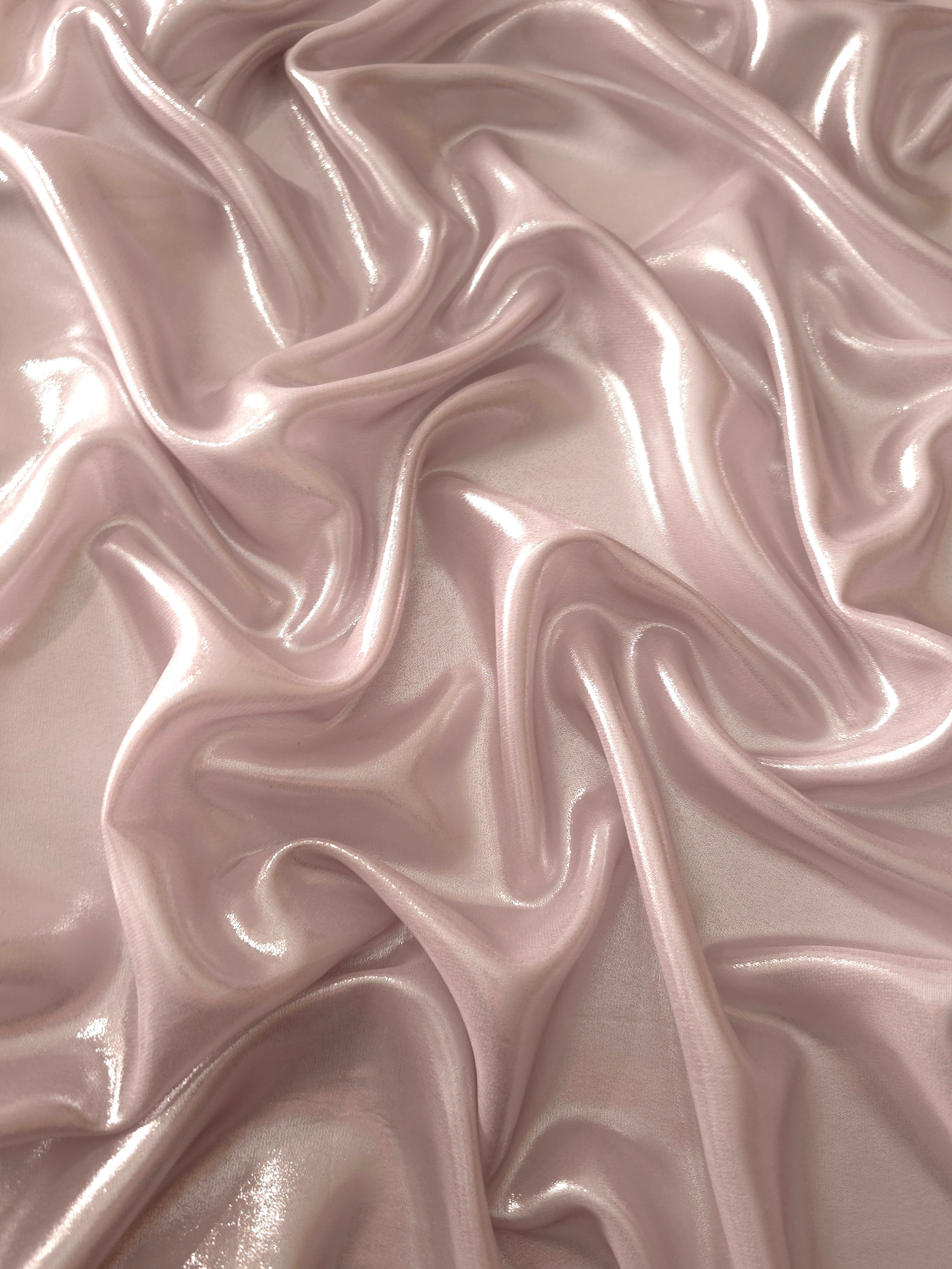 Rose blush texture close-up of liquid metallic shimmer chiffon fabric, showing lightweight reflective fabric texture and drape