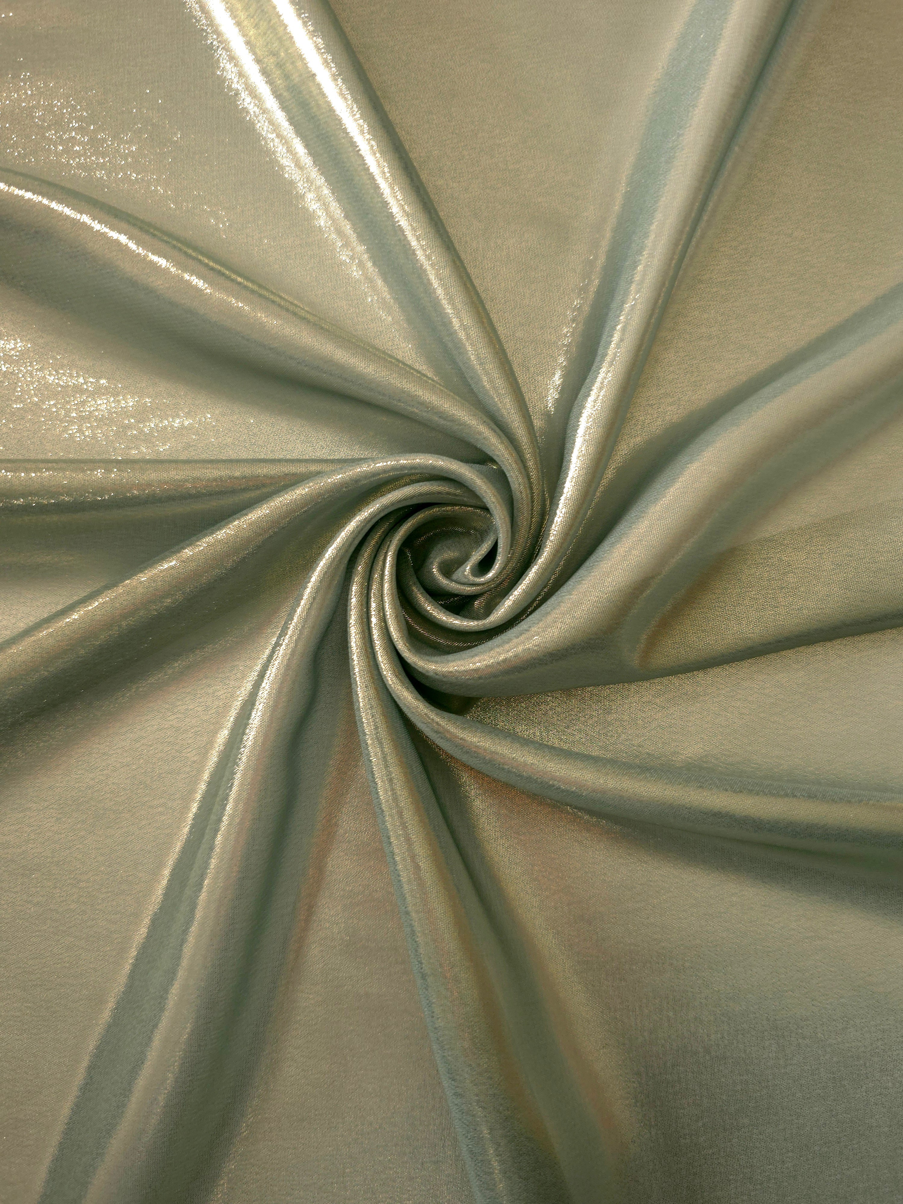 Sage green shimmer close up view of liquid metallic shimmer chiffon fabric, highlighting fluid folds and reflective surface