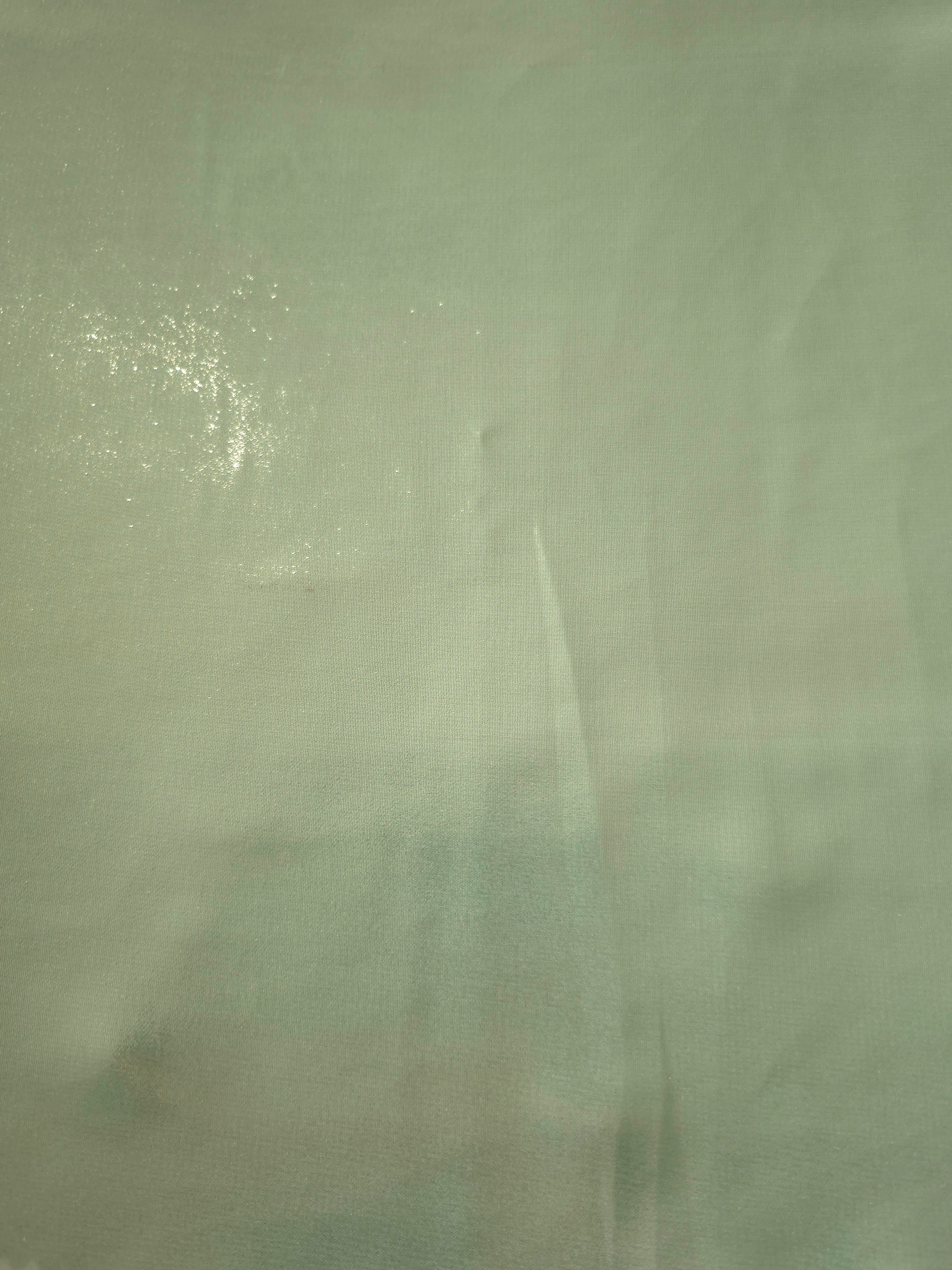 Sage silver fabric overview of liquid metallic shimmer chiffon fabric, showing lightweight reflective fabric texture and drape