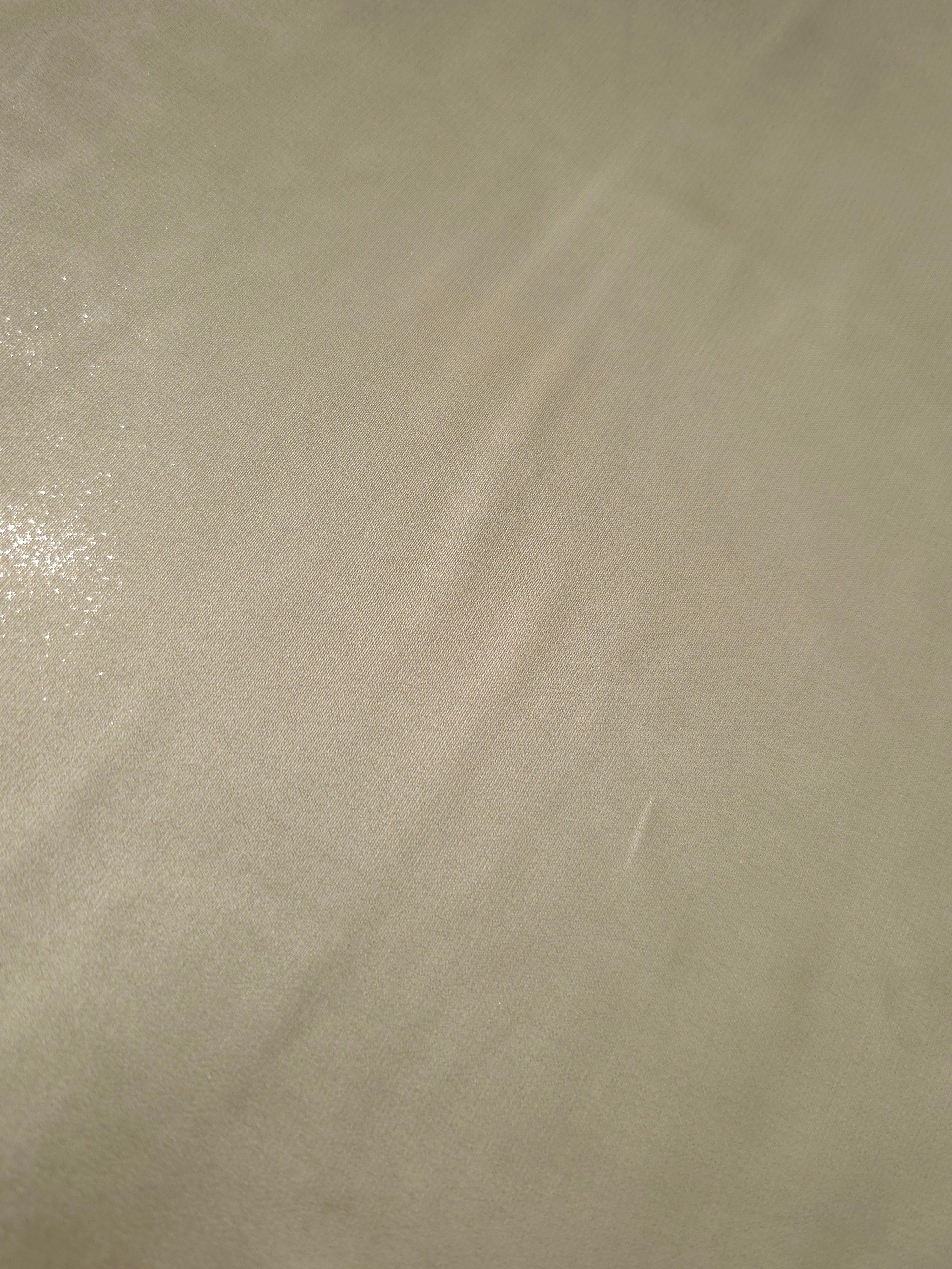 Silver sage fold detail of liquid metallic shimmer chiffon fabric, showing lightweight reflective fabric texture and drape